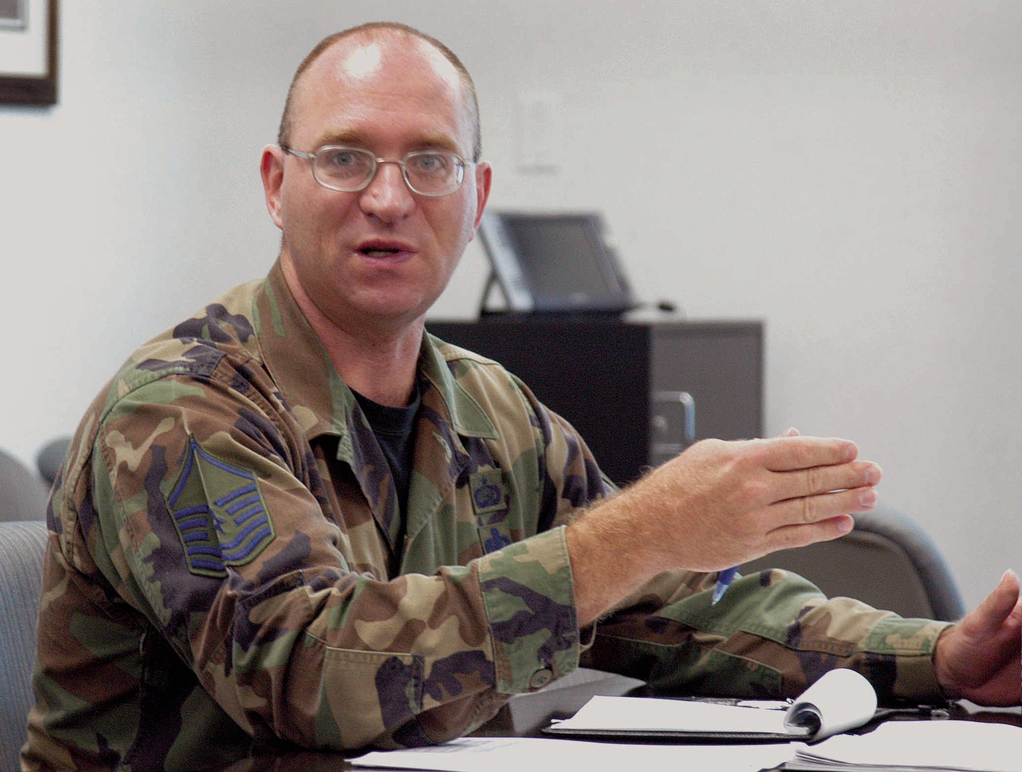 Master Sgt. Daniel Davies, superintendent and first sergeant of the 5th Manpower Requirements Squadron, discusses personnel issues during a recent meeting. (Air Force photo by Margo Wright)
