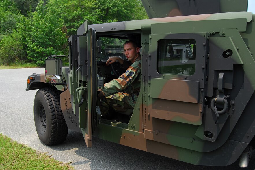 Staff Sgt. Tim Bele, 820th Security Forces Group vehicle maintenance craftsman, performs a daily inspection of one of the 820th SFG’s armored Humvees equipped with frag 5 armor Aug. 6 at Moody Air Force Base, Ga. The vehicle’s 600-pound doors and additional armor plating help protect crews from improvised explosive devices. (U.S. Air Force photo by Tech. Sgt. Parker Gyokeres)