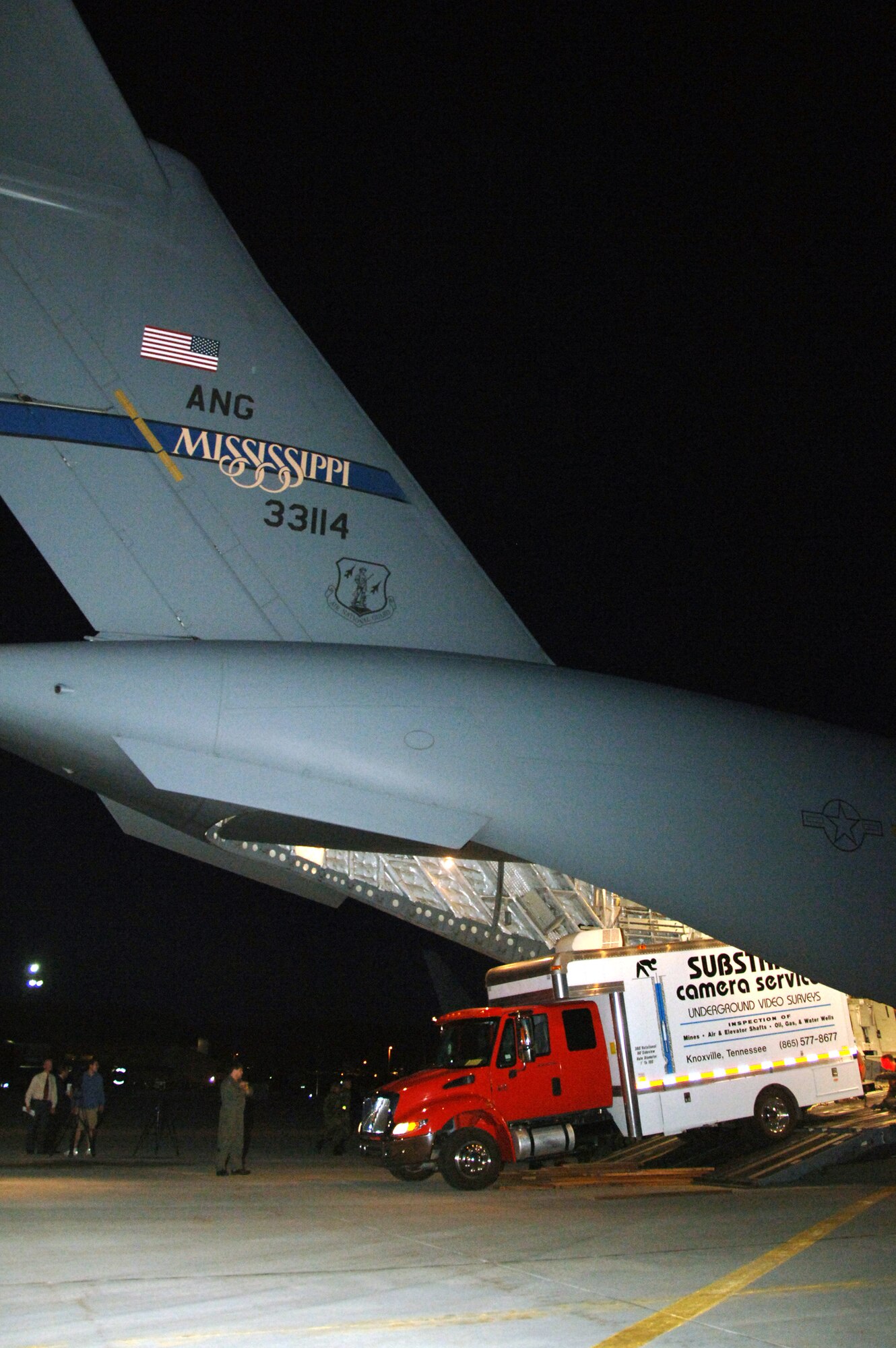 Airmen from the 151st Air Refueling Wing in Salt Lake City assist in the arrival of a C-17 Globemaster III from the Mississippi Air National Guard's 172nd Airlift Wing Aug. 9. The C-17 transported equipment used by Substrata Camera Services of Knoxville, Tenn., from its location in Topeka, Kan., to assist in rescue operations for six stranded Utah miners. The equipment will allow rescuers the ability to position a camera in the mine and assess the situation from a 360-degree angle. It will allow rescue crews to have a better idea of conditions inside the collasped mine. (U.S. Air Force photo/Master Sgt. Burke Baker)
