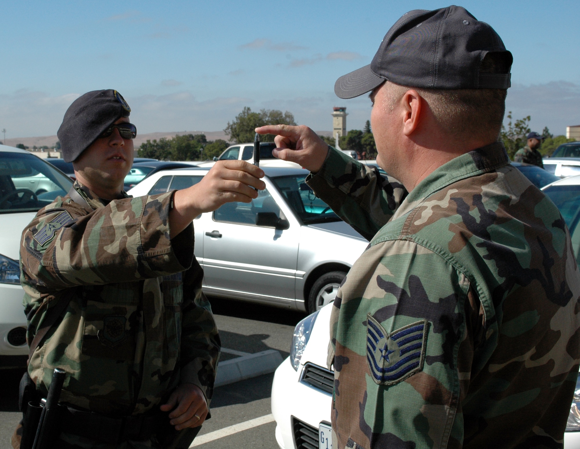 Staff Sgt. Chris Crankshaw, 60th Security Forces Squadron, demonstrates a field sobriety test with an Airman. (U.S. Air Force photo/Airman 1st Class Kristen Rohrer)