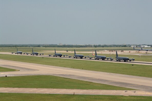 MCCONNELL AIR FORCE BASE, Kan. -- Six McConnell KC-135 Stratotankers demonstrate the "elephant walk" formation as they taxi down a runway here Aug. 5 during a generation exercise. The exercise showcased McConnell aircrews’ capability to prepare a flight and take off within minutes of being notified of a mission. These types of exercises are conducted randomly each year. (Photo by Tech. Sgt. Chyrece Campbell)