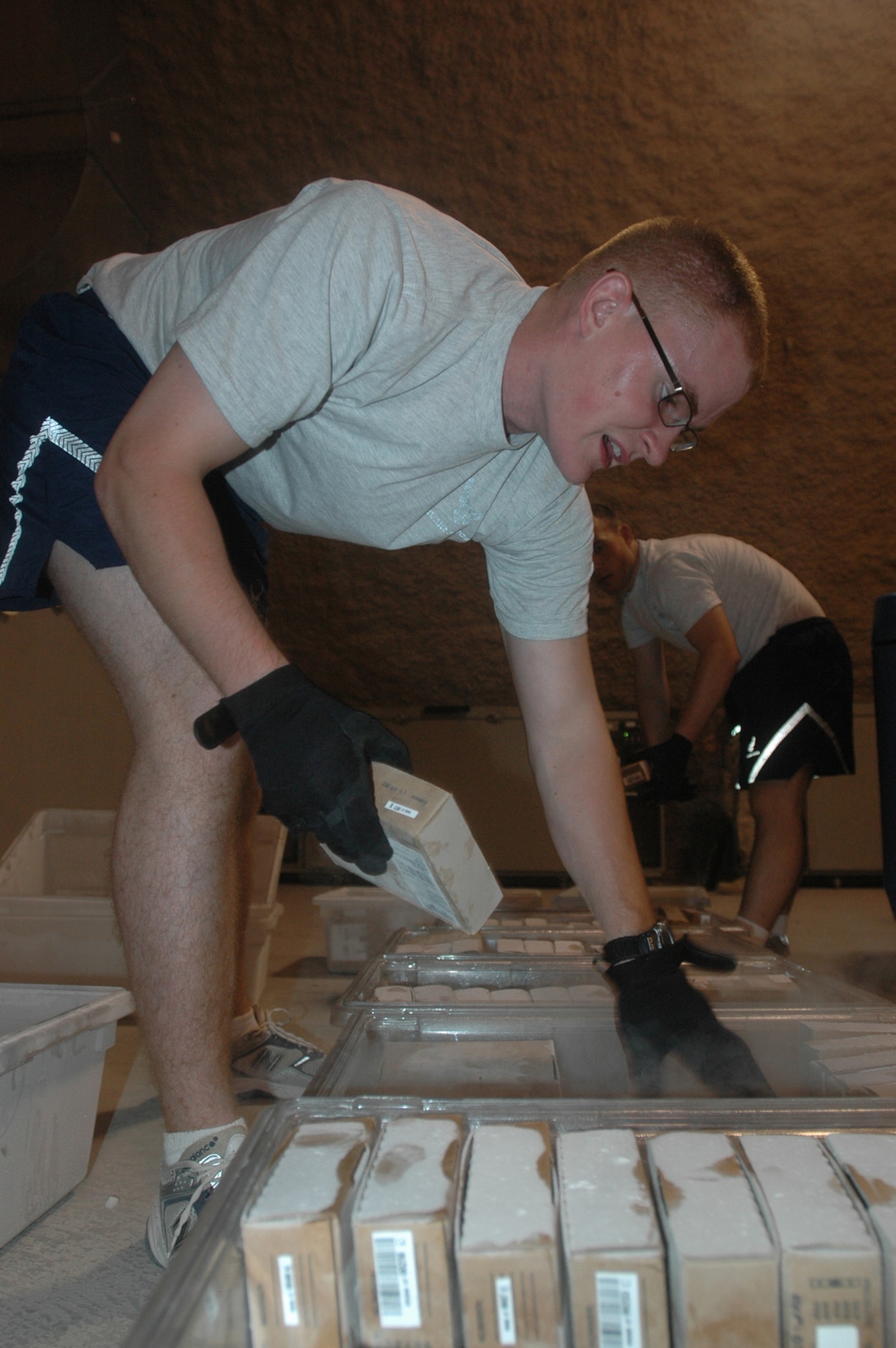 Airman 1st Class Josh Muse, 379th Air Expeditionary Wing, sorts blood components by blood type at the 379th Expeditionary Medical Group’s blood transshipment center. From here, the components are processed into the Transportable Defense Blood Standard System, which keeps track of each unit.  (U.S. Air Force photo by Senior Airman Clark Staehle)