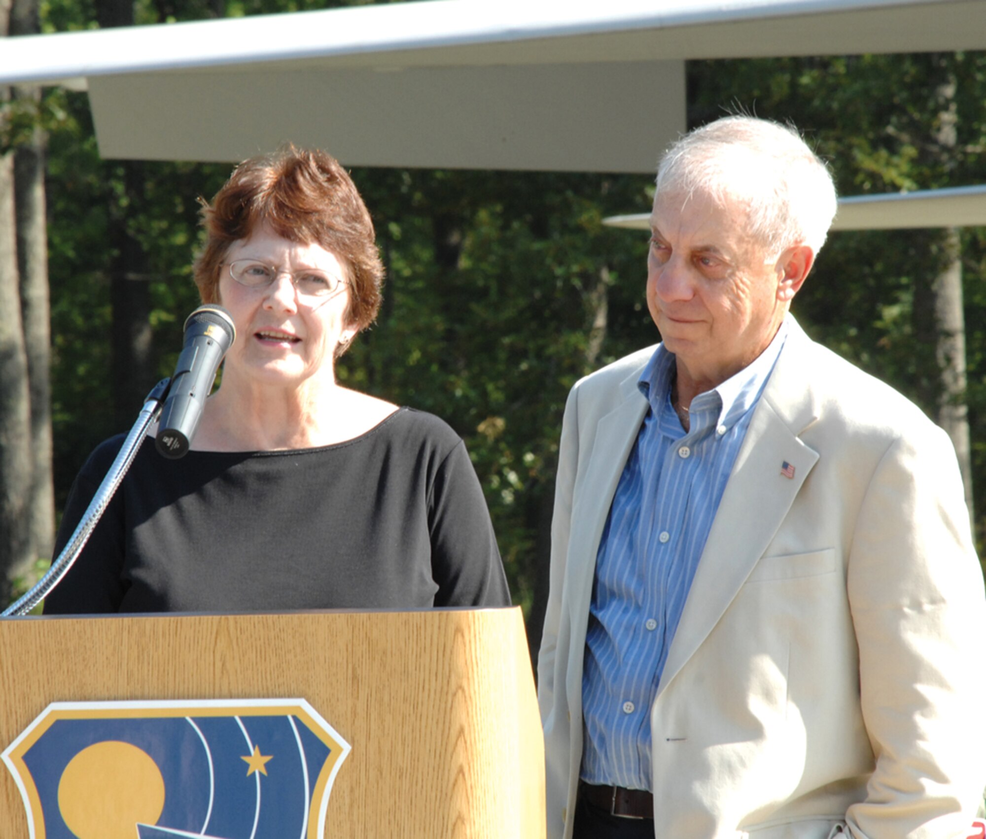 Irene and Art Duricy, parents of Major Jim Duricy, speak to those attending the F-15 dedication.