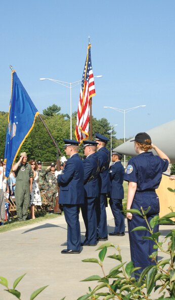Those attending the F-15 Eagle dedication ceremony salute as Arnold’s Honor Guard present the flag at the beginning of the event Aug. 9.