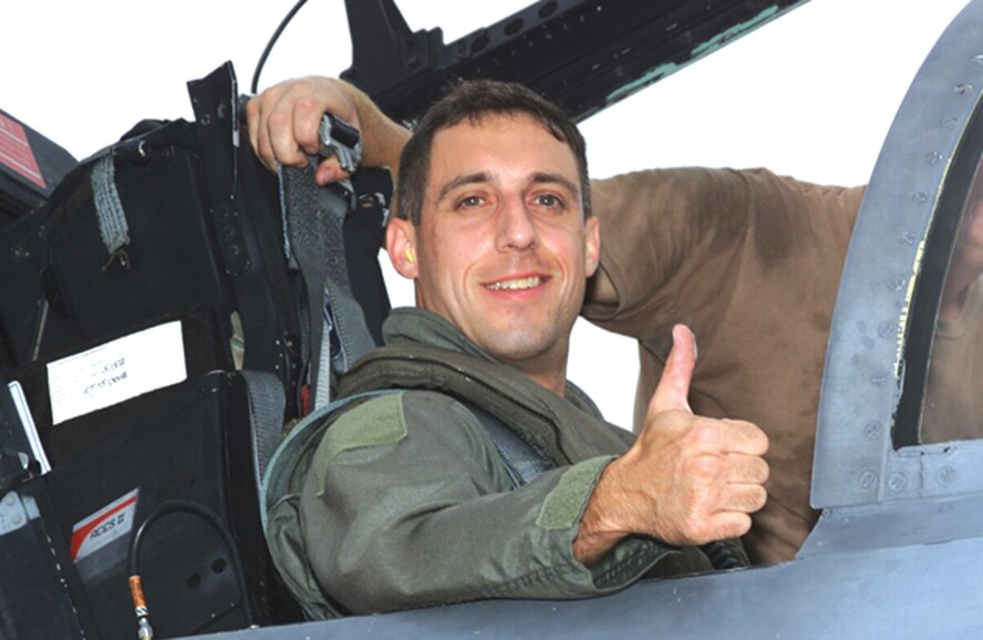 Informal portrait photo of Major Jim Duricy in the cockpit of an F-15 Eagle prior to departing on a training mission.