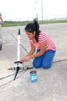 Maricela Garcia, 11, prepares to launch a rocket Aug. 3 that she made during the last Starbase Kelly academy held this summer at Lackland Air Force Base, Texas. The five-day educational program has been sponsored since 1995 by the 433rd Airlift Wing. Maricela is the daughter of civilian employee Cristina Garcia. (USAF photo by Alan Boedeker)
