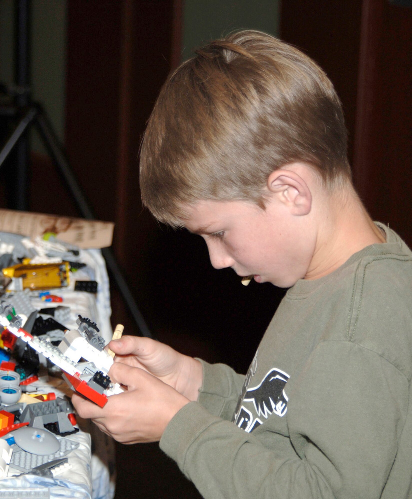 MCCONELL AIR FORCE BASE, Kan. – Team McConnell family member Calum Weeks, 8, plays with building blocks during the Lego workshop at Robert J. Dole Community Center, Aug. 2. The workshop helps members share ideas for the upcoming Create a Masterpiece Contest.  (Photo by Amn Justin Shelton)