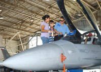 Maricela Garcia, daughter of civilian employee Cristina Garcia, and Tyler Davis, son of  Tech. Sgt. John T. Davis II with the 37th Medical Group, check out the cockpit of an F-16 Falcon. Juan Villarreal, assistant director of Starbase Kelly, briefed the academy students on the aircraft Aug. 1, just days before the end of the five-day camp on the basics of aerospace science. Starbase Kelly is conducted at Lackland Air Force Base, Texas. (USAF photo by Sid Luna)                               