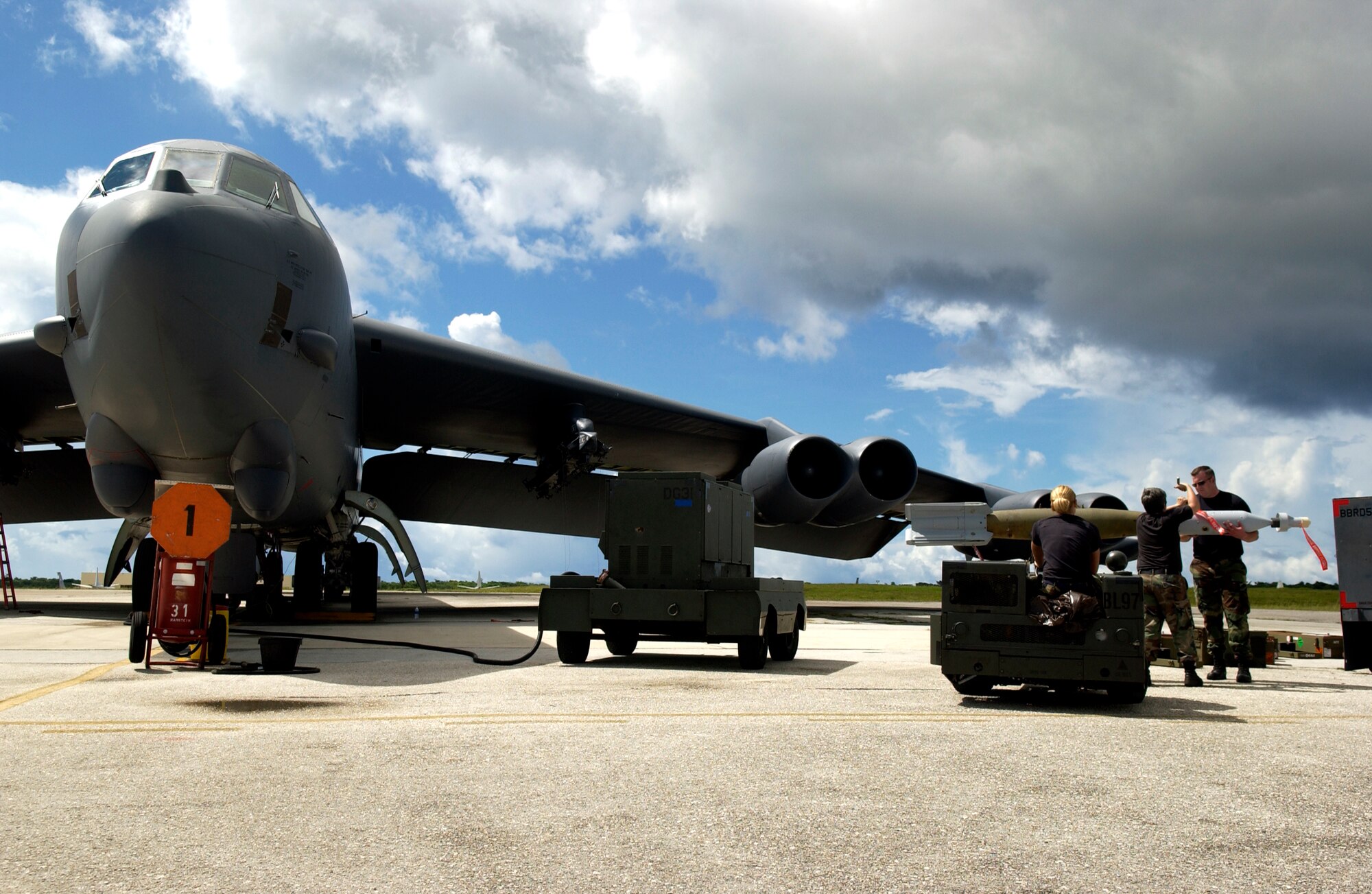 ANDERSEN AIR FORCE BASE, Guam - A weapons load team prepares to load a Guided Bomb Unit -12 onto a B-52 before a mission as part of Valiant Shield 2007 Aug. 6, 2007.  During the exercise, U.S. Air Force aircraft and personnel from stateside bases and Kadena Air Base, Japan, work together as part of an expeditionary air wing based at Andersen AFB, Guam. Andersen AFB will also be the beddown location for approximately 64 U.S. Air Force and 29 U.S. Navy aircraft, plus transient aircraft, during Valiant Shield. Valiant Shield 07, the largest joint exercise in recent history, includes 30 ships, more than 280 aircraft and more than 20,000 service members from the Navy, Marine Corps, Air Force and Coast Guard. (U.S. Air Force photo by Senior Airman Miranda Moorer)