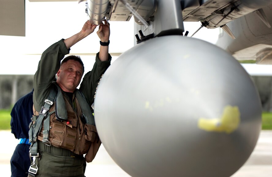 ANDERSEN AFB, GUAM--A pilot from the 44th Fighter Squadron, Kadena Air Base, Japan, does pre-flight checks before flying an F-15, Aug. 8, 2008.  During the exercise, U.S. Air Force aircraft and personnel from stateside bases and Kadena Air Base, Japan, work together as part of an expeditionary air wing based at Andersen AFB, Guam.  Andersen AFB will also be the beddown location for approximately 64 U.S. Air Force and 29 U.S. Navy aircraft, plus transient aircraft, during Valiant Shield. Valiant Shield 07, the largest joint exercise in recent history, includes 30 ships, more than 280 aircraft and more than 20,000 service members from the Navy, Marine Corps, Air Force and Coast Guard. (U.S. Air Force photo by Senior Airman Miranda Moorer)