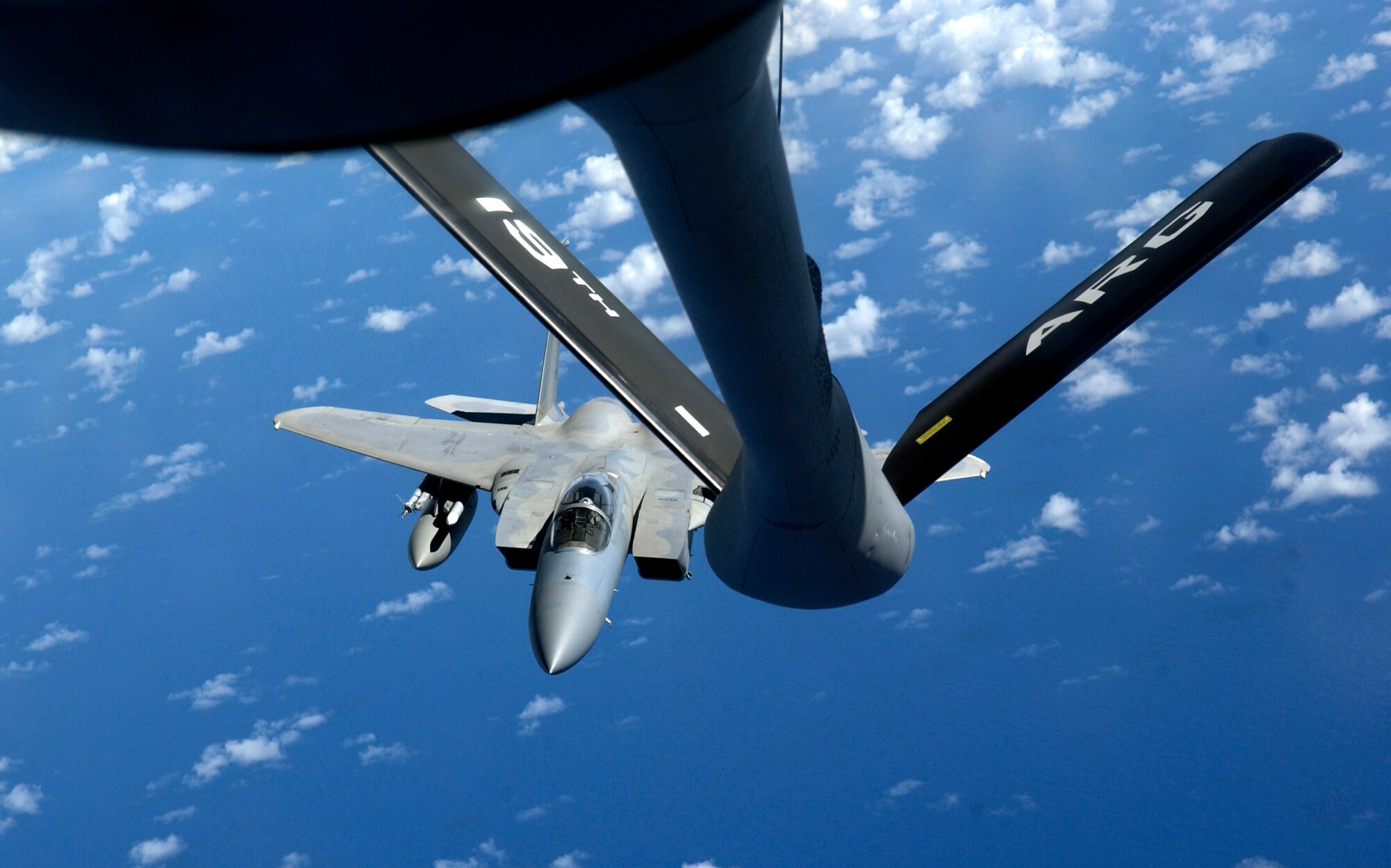 ANDERSEN AFB, GUAM -- An F-15 deployed here from the 44th Fighter Squadron, Kadena Air Base, Japan, approaches the boom of a KC-135 Stratotanker, from the New Hampshire Air Nation Guard, during Valiant Shield, Aug. 9, 2007.  During the exercise, U.S. Air Force aircraft and personnel from stateside bases and Kadena AB will comprise part of an expeditionary air wing based at Andersen AFB, Guam.  These forces will participate in integrated joint training with Navy and Coast Guard forces.  Andersen AFB will also be the beddown location for approximately 64 U.S. Air Force and 29 U.S. Navy aircraft, plus transient aircraft, during Valiant Shield. (U.S. Air Force photo by Senior Airman Miranda Moorer)                                 