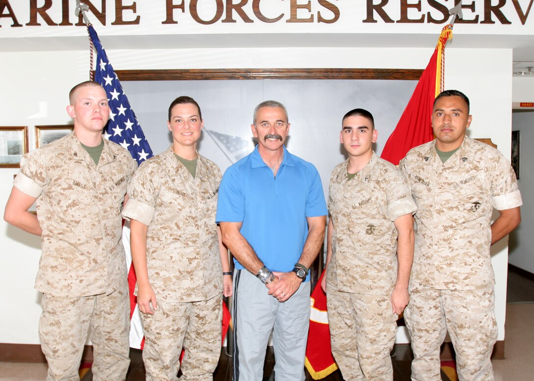 Marines from MarForRes met Aaron Tippin following his tour of the Hall of Ultimate Sacrifice. (Clockwise, from left): Lance Cpl. Kristopher W. Twiss, Maj. Julia S. Hunt, Aaron Tippin, Lance Cpl. Alexandar R. Pirolo, and Sgt. Jose B. Don Juan. Tippin is a long-time supporter of the U.S. military and has played concerts for U.S. service members in Iraq or Afghanistan every Thanksgiving since 2002.