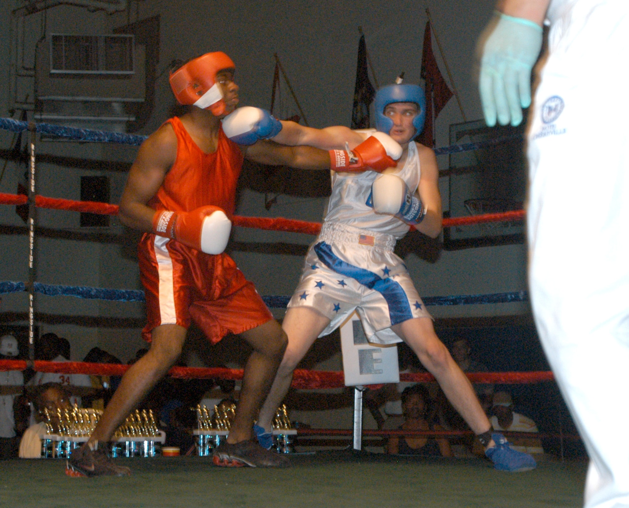 U.S. ARMY GARRISON HUMPHREYS, South Korea -- Kunsan Air Base's Devin Goodnoe matches a right jab from USAG Casey's Elzavon Maxie during the 2007 summer Smoker Boxing Tournament Aug. 11 here. Maxie's larger arms couldn't trump his slower speed, giving Goodnoe the advantage in the third for the win. (U.S. Air Force photo/Staff Sgt. Darcie Ibidapo)