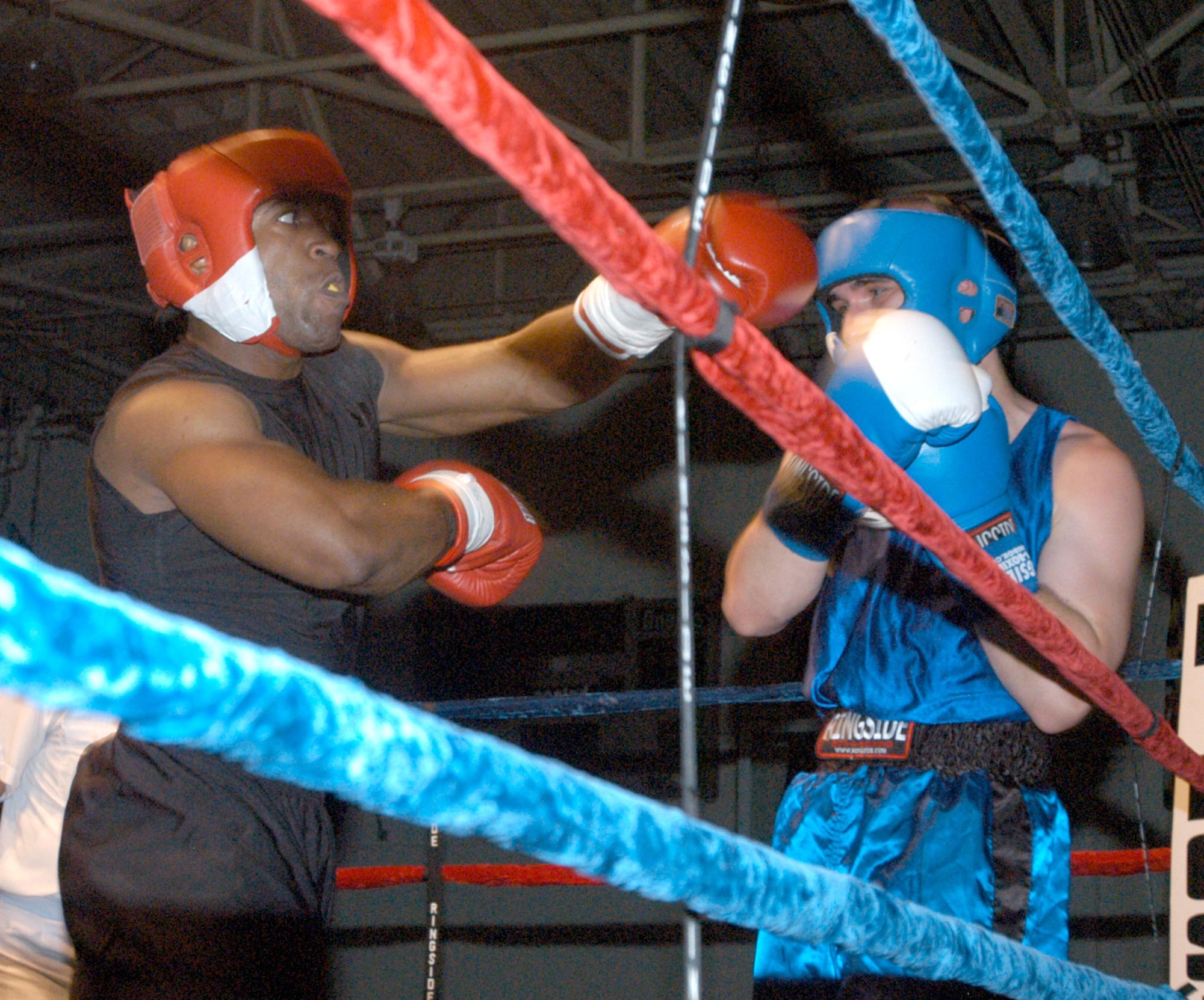 U.S. ARMY GARRISON HUMPHREYS, South Korea - Jeff Duncan, representing USAG Yongsan, swings and misses in a bout against Kunsan Air Base's John Hoskins during the 2007 summer Smoker Boxing Tournament on Aug. 11 here. Judges awarded Duncan with the win. (U.S. Air Force photo/Staff Sgt. Darcie Ibidapo)