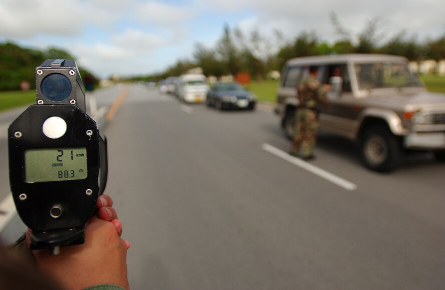 Airman 1st Class Russell Almanza and Senior Airman Eric Proctor, members of the 18th Security Forces Squadron traffic safety unit, enforce speed regulations at Kadena Air Base, Japan, by using a Lidar speed  detector near Gate 1, Aug. 8. The traffic safety unit was implemented three months ago to reduce accidents and promote safety on and off base.
U.S. Air Force photo/Staff Sgt. Reynaldo Ramon