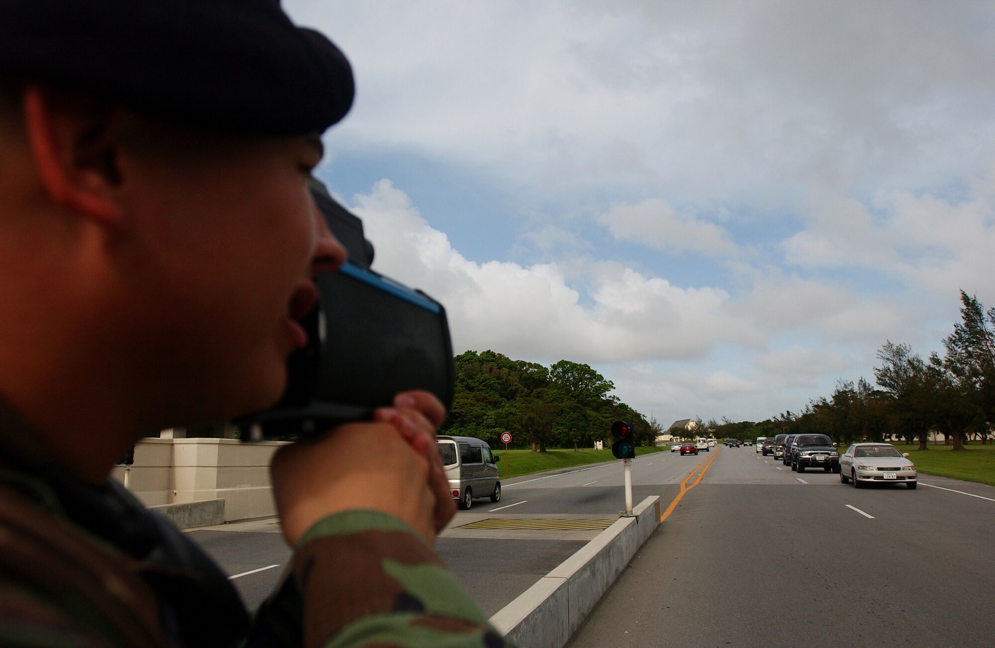 Airman 1st Class Russell Almanza, a member of the 18th Security Forces Squadron traffic safety unit, enforces speed regulations at Kadena Air Base, Japan, by using a Lidar speed  detector near Gate 1, Aug. 8. The traffic safety unit was implemented three months ago to reduce accidents and promote safety on and off base.
U.S. Air Force photo/Staff Sgt. Reynaldo Ramon