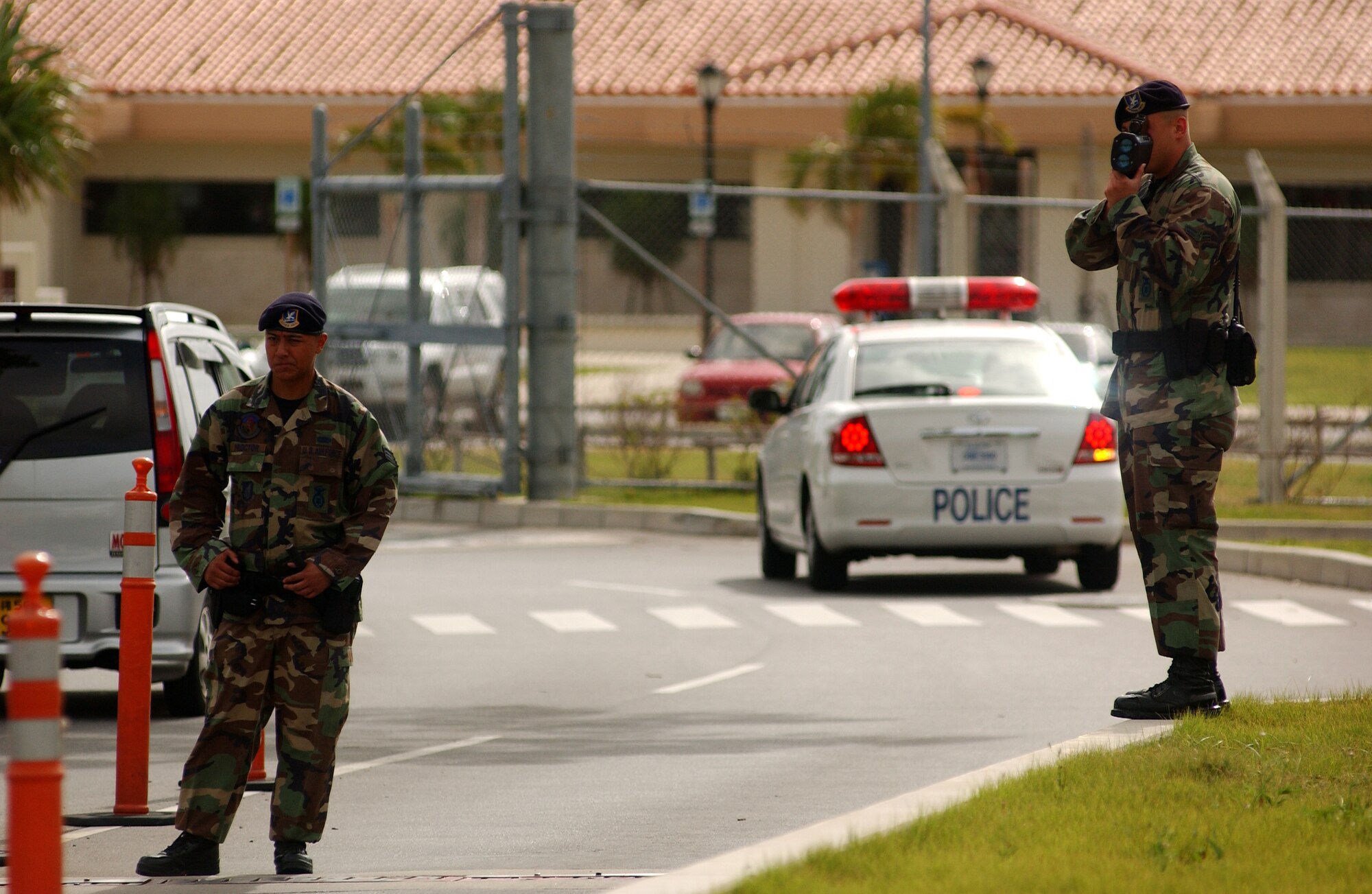 Airman 1st Class Russell Almanza and Senior Airman Eric Proctor, members of the 18th Security Forces Squadron traffic safety unit, enforce speed regulations at Kadena Air Base, Japan, by using a Lidar speed detector near Gate 1, Aug. 8. The traffic safety unit was implemented three months ago to reduce accidents and promote safety on and off base.
U.S. Air Force photo/Staff Sgt. Reynaldo Ramon
