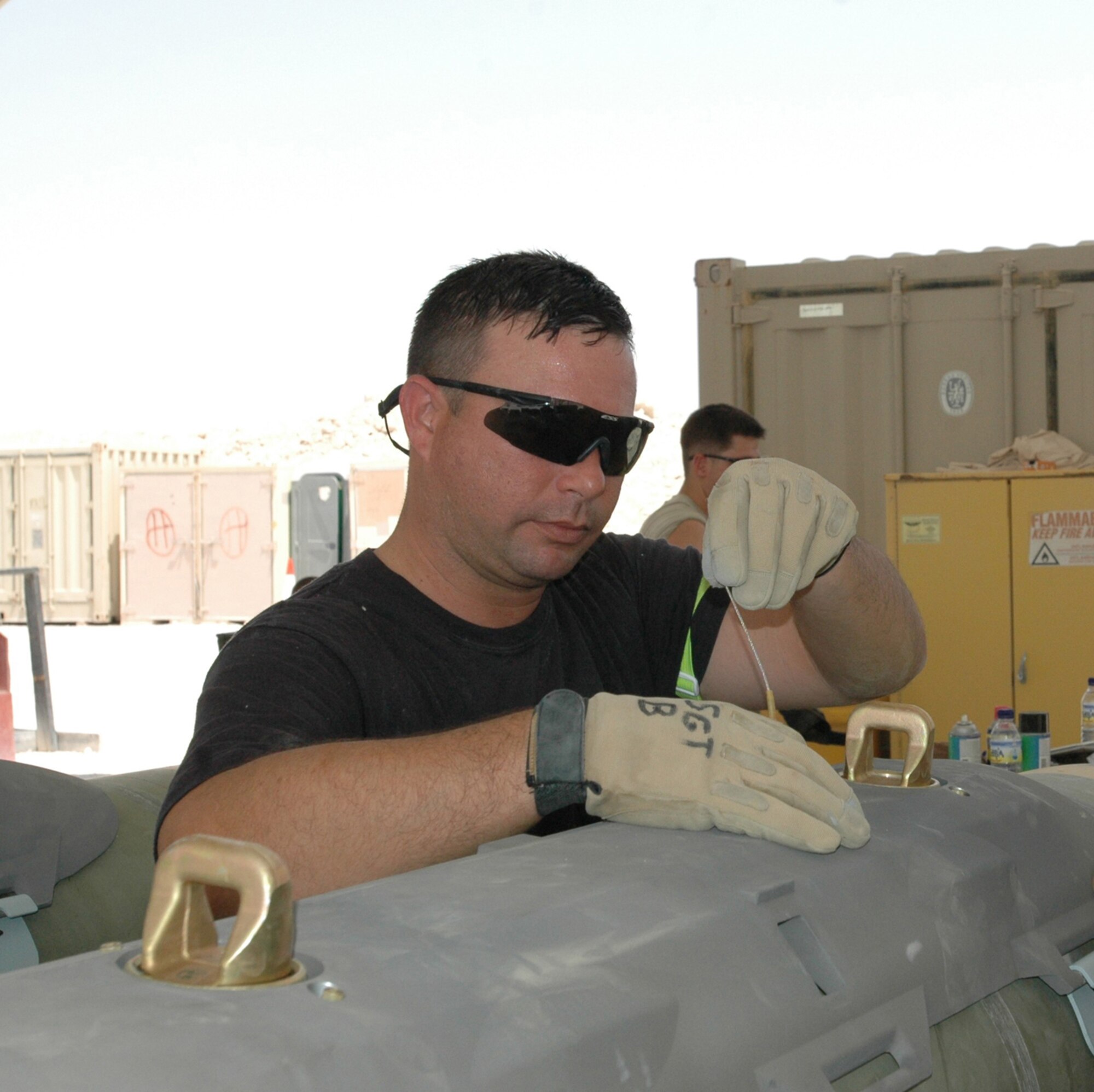 Staff Sgt. Donald Buono, 379th Expeditionary Maintenance Squadron, ammo flight, fuzes a guided bomb unit-31. (U.S. Air Force photo by Capt. Teresa Sullivan)