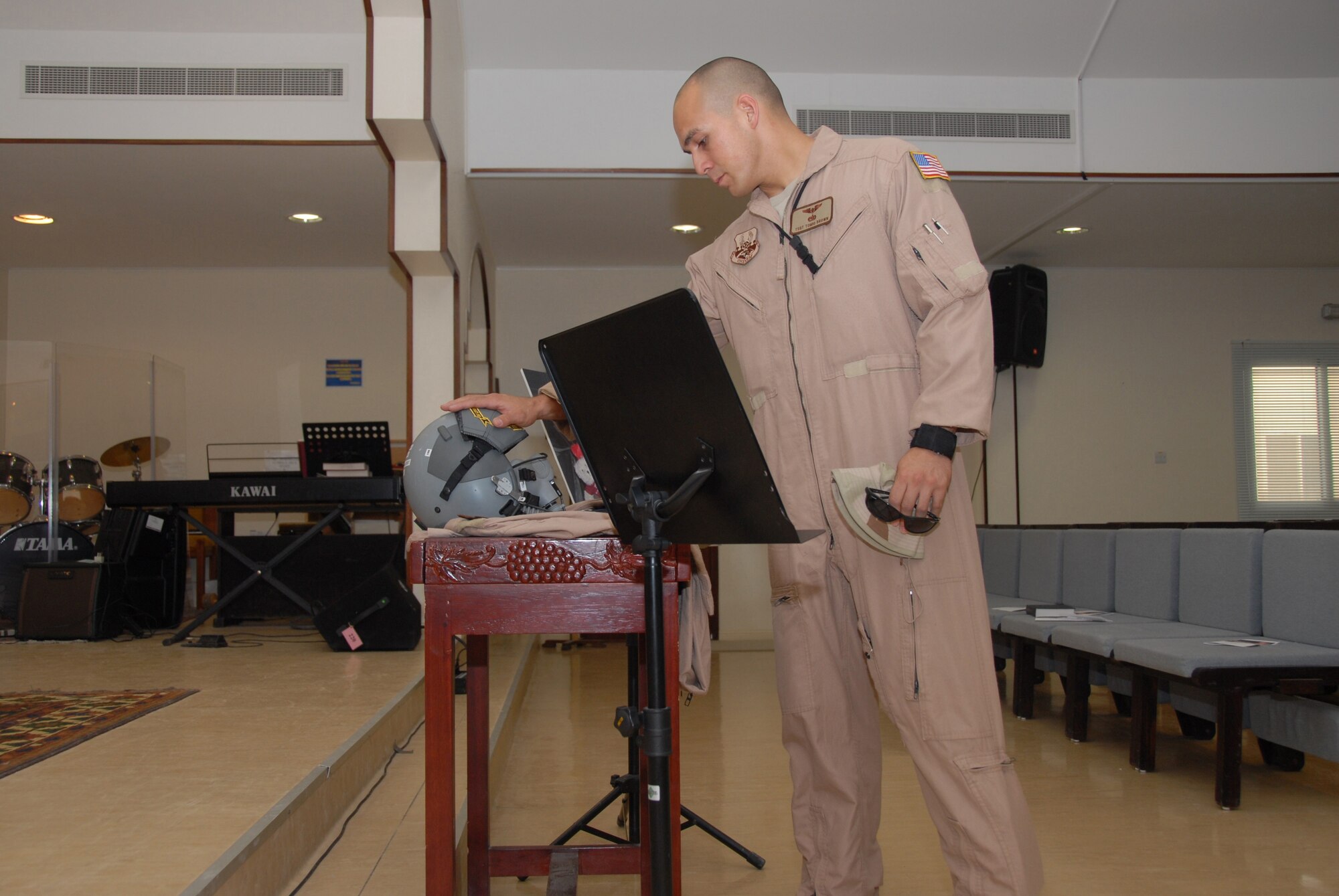 Tech. Sgt. Tomio Brown, 746th Expeditionary Airlift Squadron, pays respect for Tech. Sgt. Joey Link at a memorial service Tuesday. (U.S. Air Force photo by Airman 1st Class Ashley Tyler)