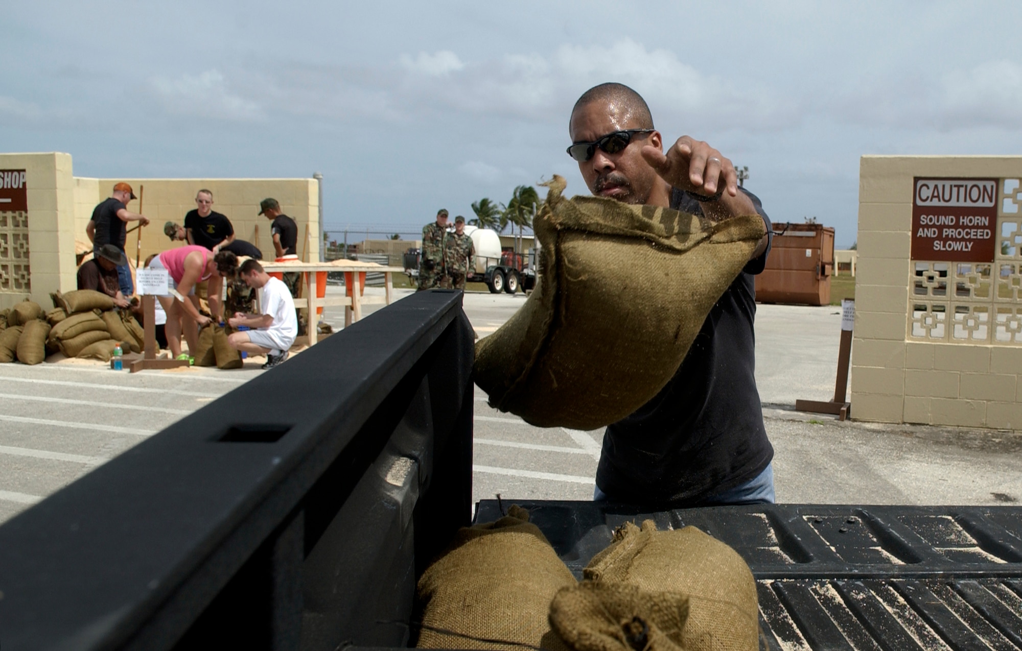 ANDERSEN AIR FORCE BASE, Guam - Family members from Andersen get sand bags from the self help store in preparation for typhoon Kong-Ray.  The 36th Wing personnel take appropriate actions and make necessary provisions in preparation for every typhoon that has the potential strike Andersen. (Air Force photo by Senior Airman Miranda Moorer)
