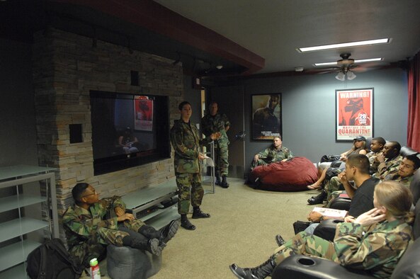 Senior Airman Christine Franchi, a Customer Support Analyst with the 99th Comptroller Squadron, goes over various topics during the Nellis Airmen Committed to Excellence (A.C.E.) meeting 7 August 2007. Airman Franchi, the organizations Secretary and other members of the executive committee, host the meetings every Tuesday at 1445 in the newly built Airman's Center's theater.
(U.S. Air Force Photo by Senior Airman Larry E. Reid Jr.)  
