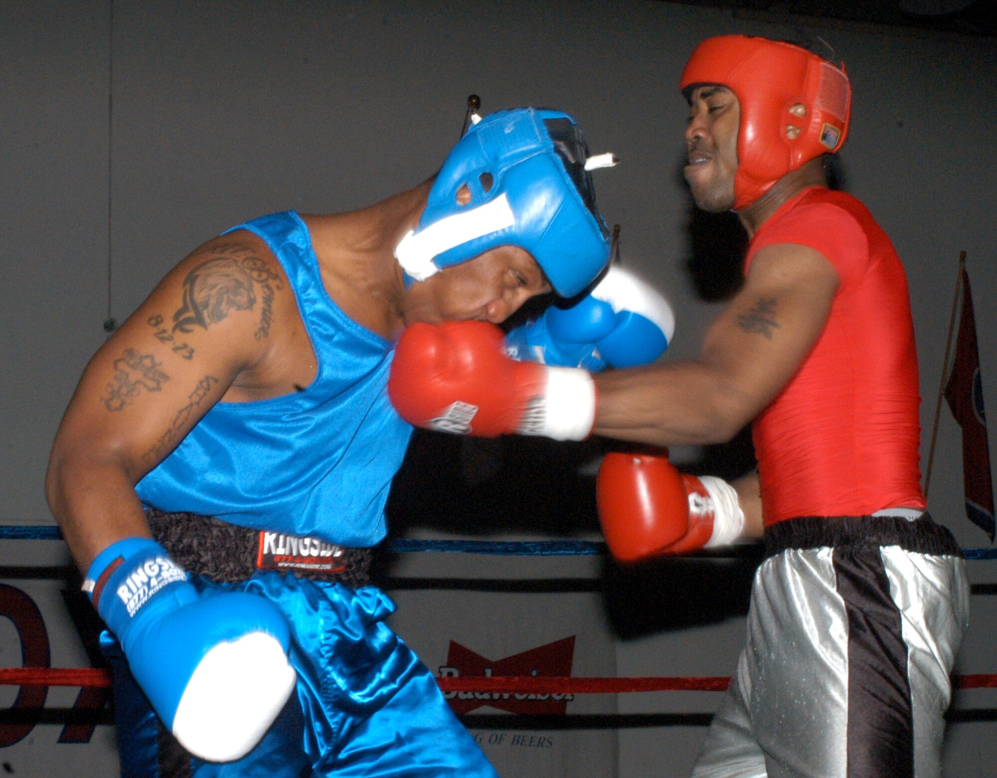 Kunsan Air Base's Devin Goodnoe matches a right jab from U.S. Army Garrison Casey's Elzavon Maxie during the 2007 summer Smoker Boxing Tournament Aug. 11 at USAG Humphreys. Maxie's larger arms couldn't trump his slower speed, giving Goodnoe the advantage in the third for the win. (U.S. Air Force photo/Staff Sgt. Darcie Ibidapo) 
