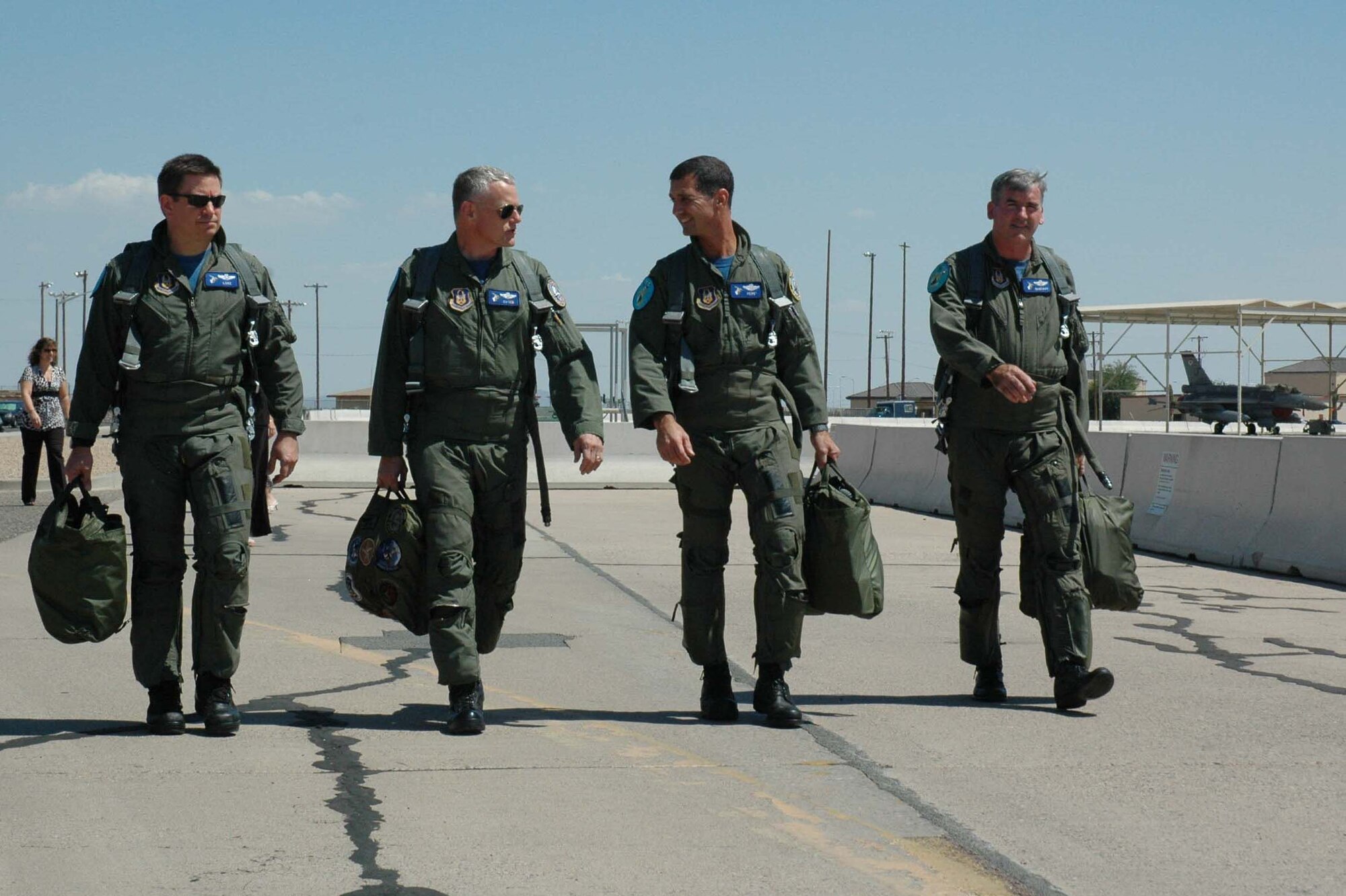 (Left to right) Maj. Gregory Lukasiewicz, Lt. Col. Robert McCutchen, Lt. Col. Guy Brilando, and Lt. Col. John Wynne, 301st Fighter Squadron pilots, step to fly Aug. 10 at the 309th Fighter Squadron. Upon completion of their mission that day, the team’s flying hours totaled 15,681.8. The 301st FS is made up of reserve pilots who, in association with the 56th Fighter Wing, fly active-duty F-16s and train active-duty student pilots at Luke Air Force Base, Ariz. The 75 pilots assigned to the 301st FS are integrated into the 56th Fighter Wing’s six fighter squadrons. On average, pilots in the 301st FS have more than 2,000 flying hours. (U.S. Air Force photo/Staff Sgt. Stephen Razo)