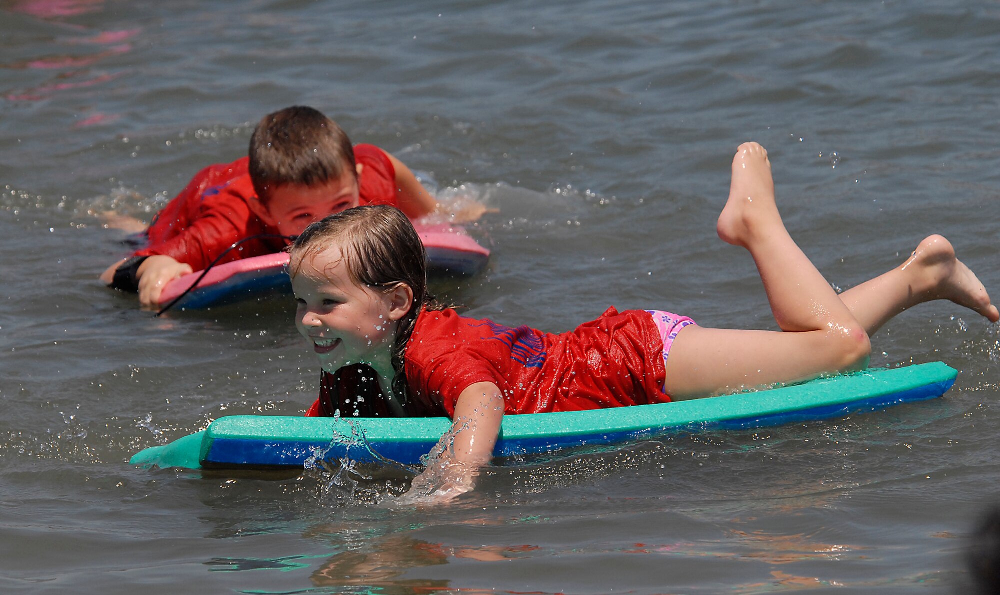 Surf's up! More than 38 children in the Youth Summer Camp Program spent the day kayaking, picnicking, and playing in the sand at Mothers’ Beach in Long Beach, Aug. 8.  (Photo by Joe Juarez)