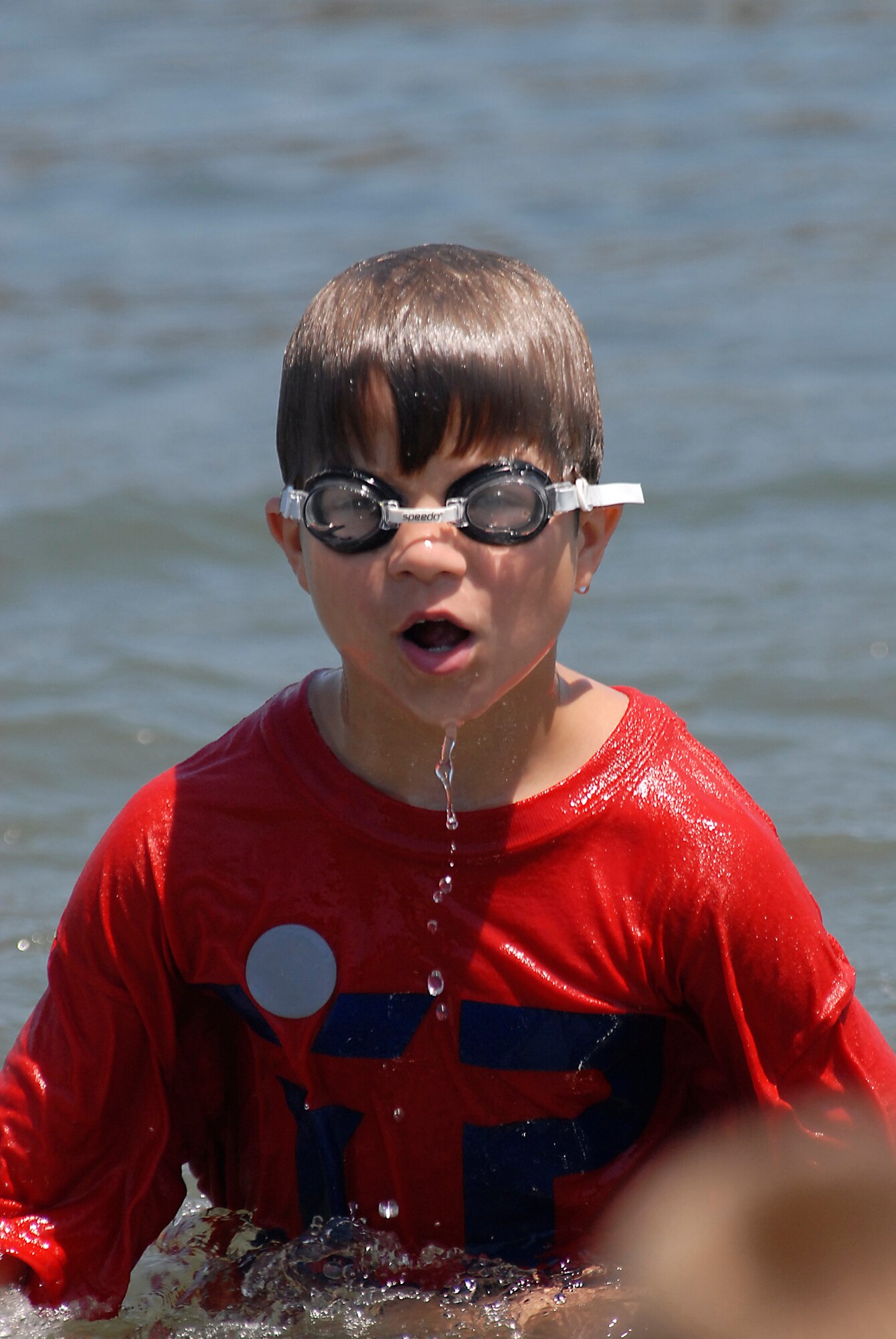 How to cool down on a hot summer day. More than 38 children in the Youth Summer Camp Program spent the day kayaking, picnicking, and playing in the sand at Mothers’ Beach in Long Beach, Aug. 8.  (Photo by Joe Juarez)