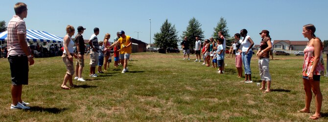 WHITEMAN AIR FORCE BASE, Mo. – Members of Team Whiteman prepare for a water balloon toss at the 14th Annual Enlisted Luau at Ike Skeleton Park Aug. 10. The luau offered prizes, games, food and fun for all enlisted personnel on base. (U.S. Air Force Photo/Airman 1st Class Cory Todd) 