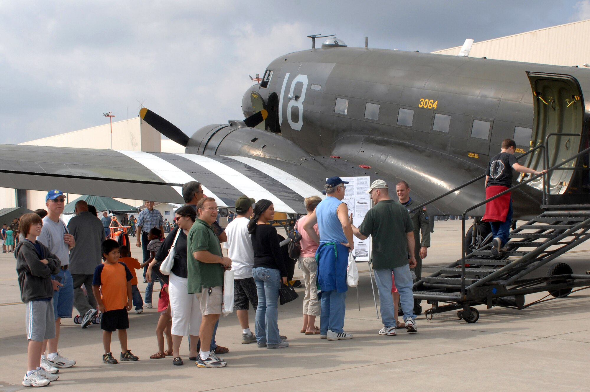 A crowd waits to board the C-47 Dakota at the U.S. Air Forces in Europe's Air Force 60th Anniversary celebration Aug. 11 at Ramstein Air Base, Germany. (U.S. Air Force photo/Airman 1st Class Kenny Holston) 