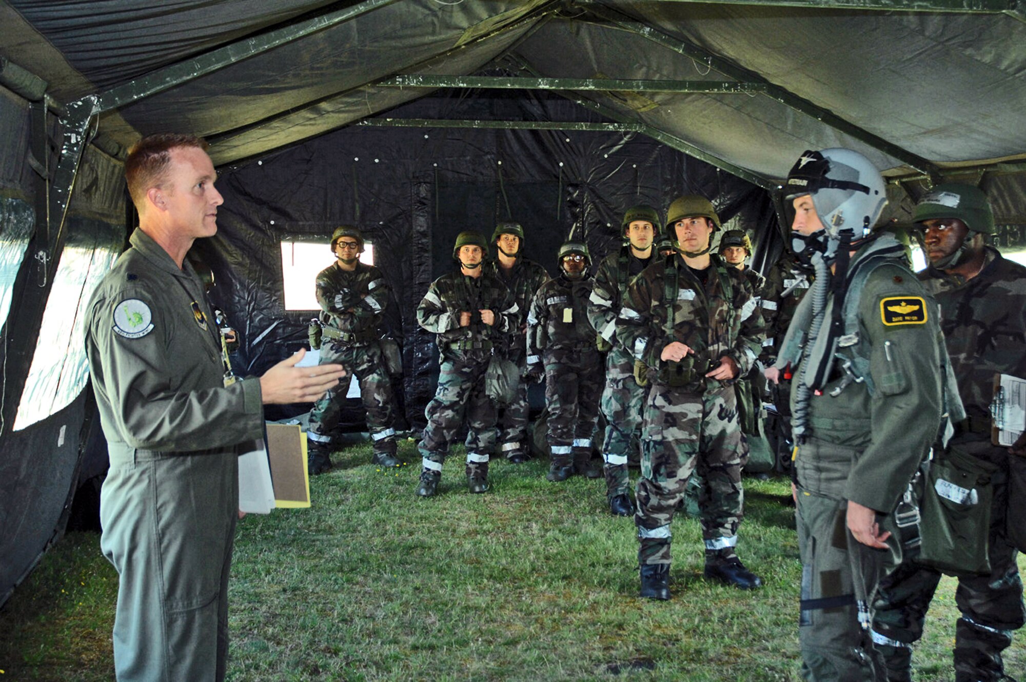 Lt. Col. Doug Jenkins briefs 48th Fighter Wing Airmen during an operations evaluation July 31 at Royal Air Force Lakenheath, England.  In this portion of the ops eval, the squadron operations center was "damaged by mortar fire."  Colonel Jenkins is the wing's chief of inspections, exercises and readiness.  (U.S. Air Force photo/Airman 1st Class John Easterling) 