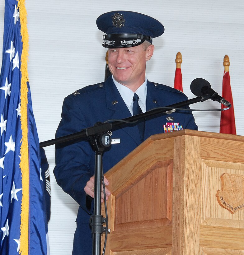 Col. David Petersen, new commander of the 80th Flying Training Wing, addresses the audience in Hangar 2048 at the change of command ceremony Aug. 10. (U.S. Air Force photo/Mike Litteken)