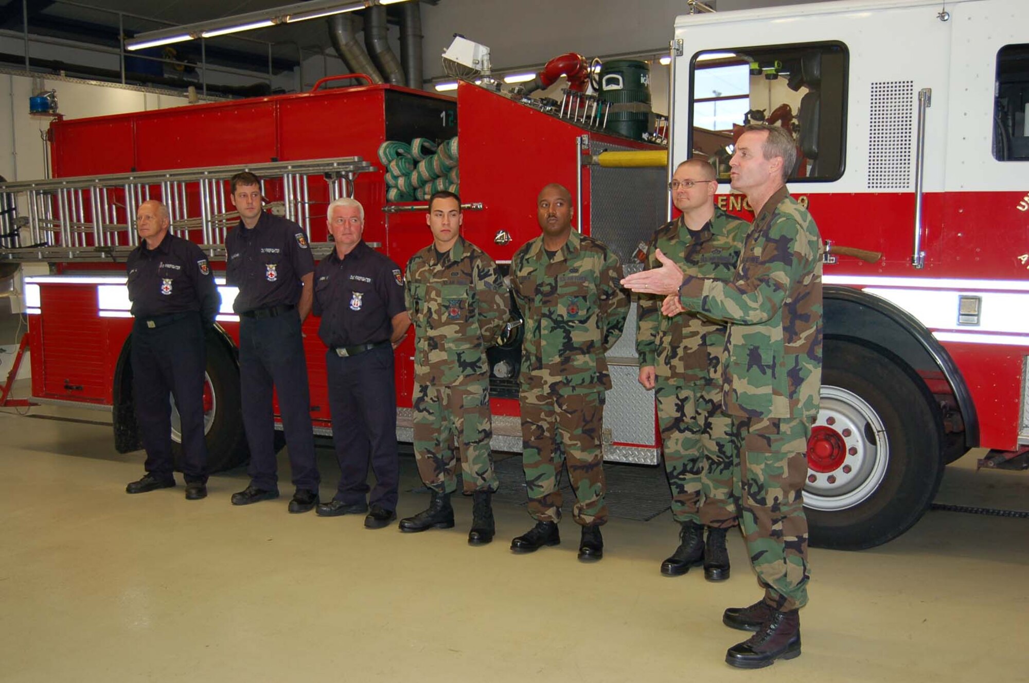 SPANGDAHLEM AIR BASE, Germany – Col. Darryl Roberson, 52nd Fighter Wing commander, thanks six firefighters from the 52nd Civil Engineer Squadron for their actions which saved the life of a fellow Saber before giving each of them his commander’s coin. (US Air Force photo/Staff Sgt. Tammie Moore)
