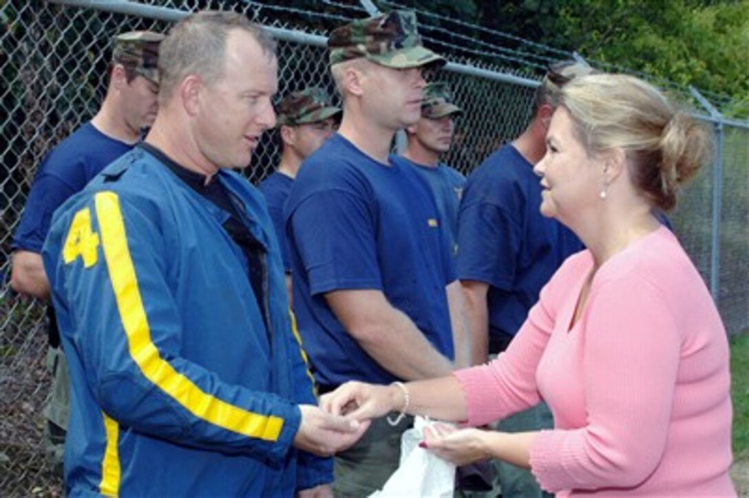 Minnesota Senator Julianne E. Ortman (right)  thanks Navy Diver 1st Class Clarence Allen of Mobile Diving and Salvage Unit 2 for his efforts in the wake of the I-35 bridge collapse in Minneapolis, Aug. 11, 2007. Ortman thanked the unit's sailors for their overall search and recovery efforts.