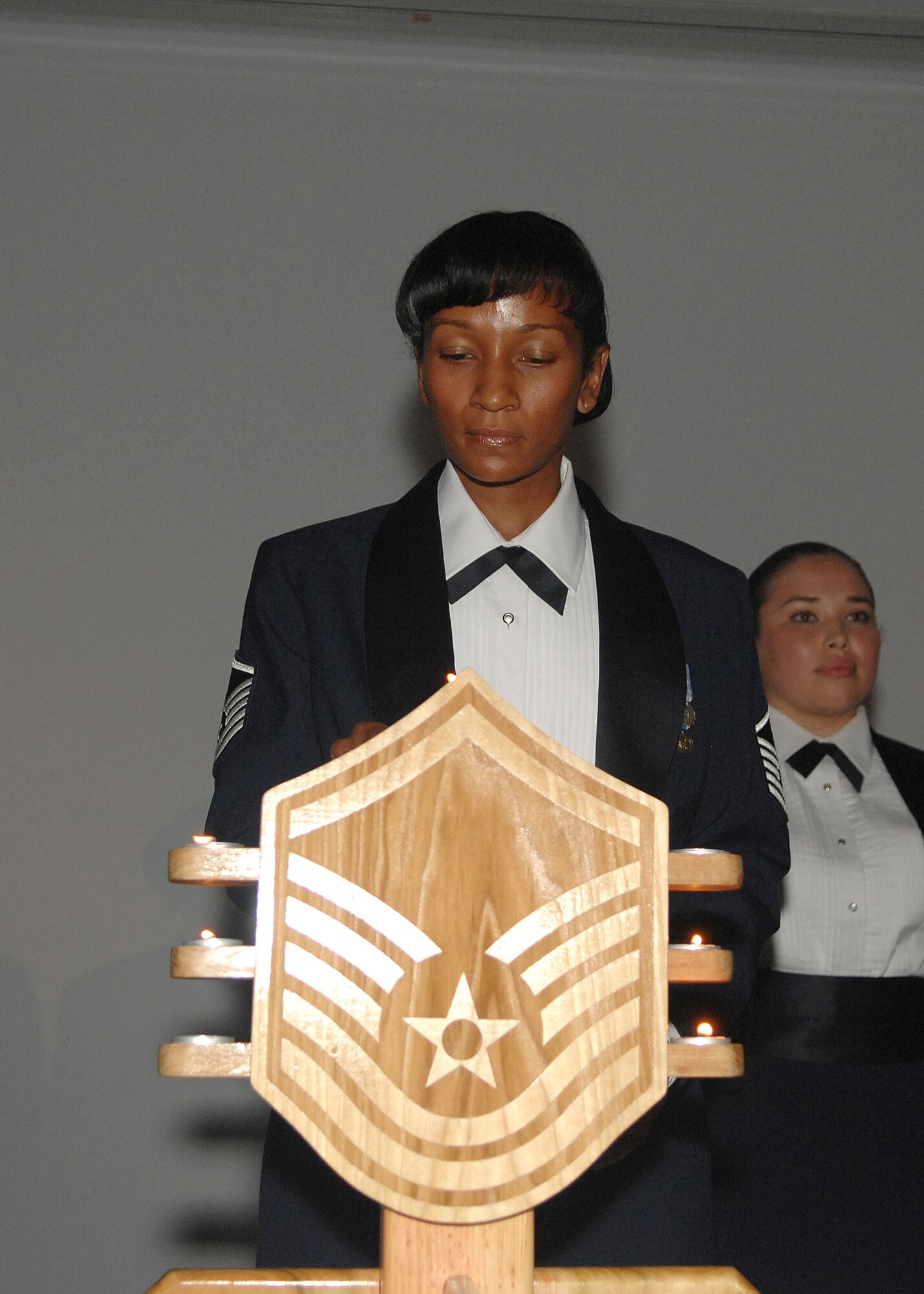 The lit Candelabra represents the nine enlisted grades of the Air Force.  Approximately 20 master sergeant selectees joined the senior NCO ranks at the second annual Senior NCO Induction Ceremony held in the Gordon Conference Center, Aug. 3. Air Force Space Command Chief Master Sgt. Michael Sullivan was the keynote speaker at the dinner. SMC’s  percentage of technical sergeants selected for promotion to master sergeant surpassed both Air Force Space Command and the Air Force. (Photo by Stephen Schester)