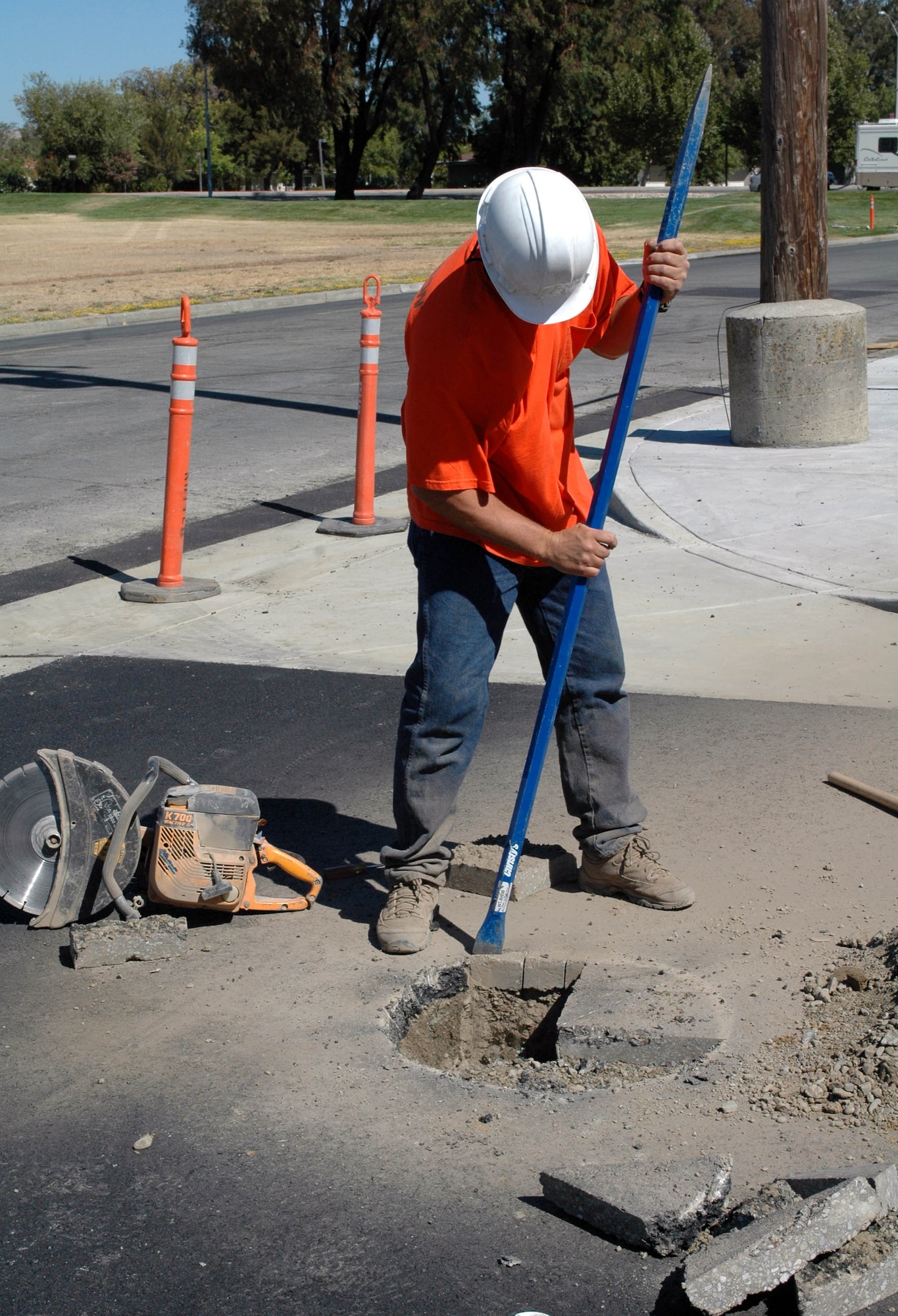 Aaron Walker chops up pieces of the road in front of the future C-17 maintenance facility building. The largest of the four current C-17 construction projects, the maintenance facility is expected to be completed in September. (U.S. Air Force photo/ Nick DeCicco)