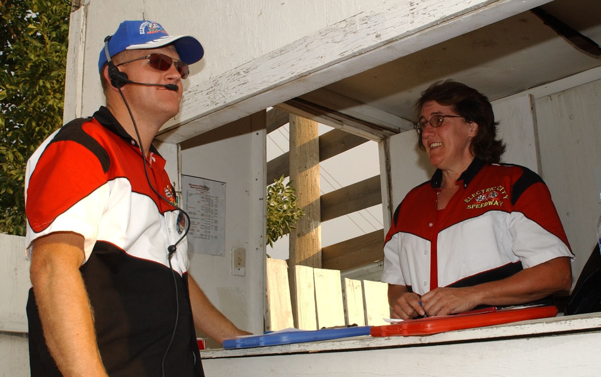 Master Sgt. Jason Jezewski 341st Maintenance Operations Squadron first sergeant and ElectricCity Speedway security superintendent, and Donna McPartlin, 341st Communications Squadron, discuss security measures at the speedway. (U.S. Air Force photo by Airman 1st Class Dillon White)                