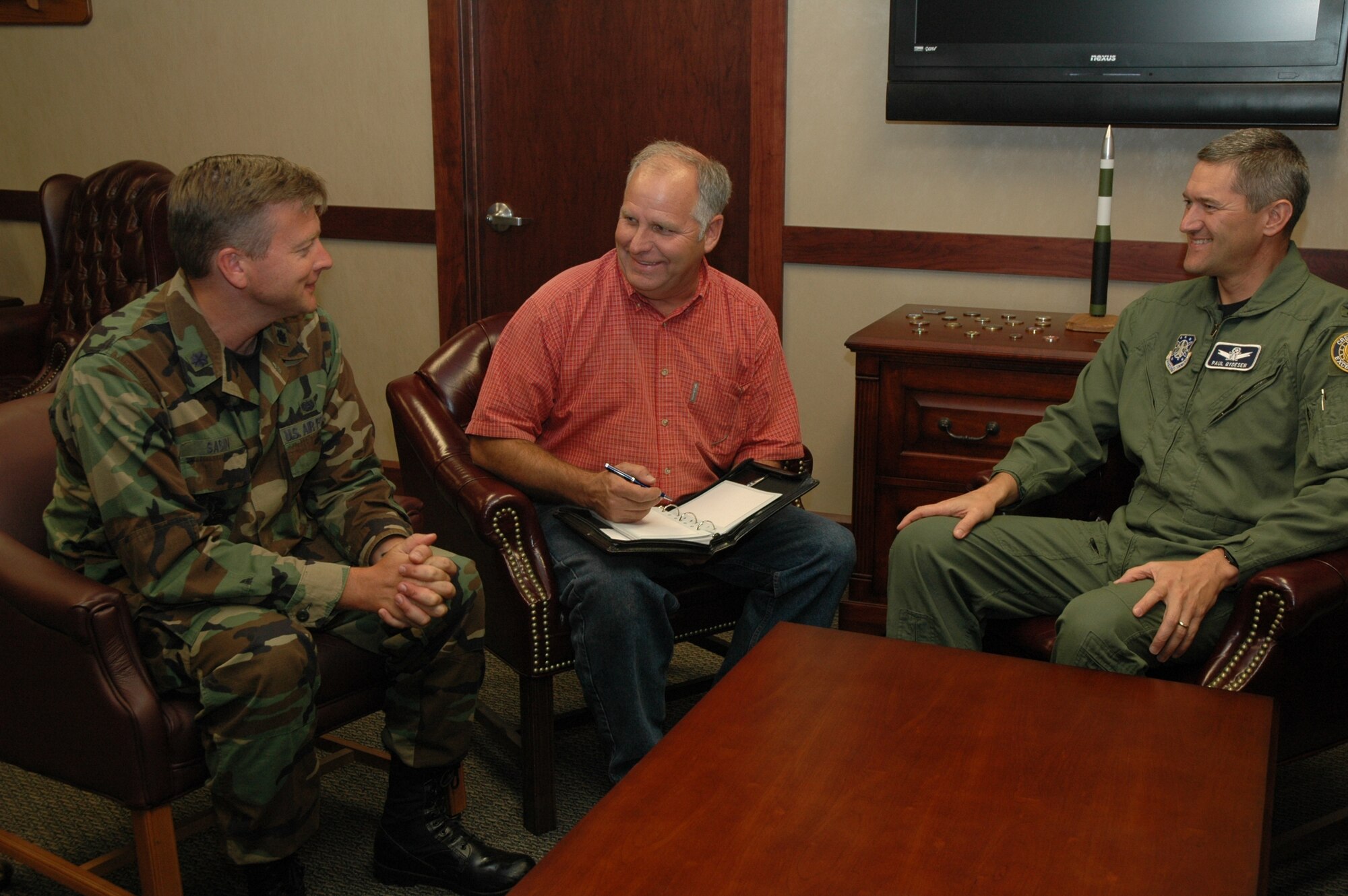 Col. Paul Gydesen, 341st Space Wing vice commander, right, discusses the Strategic Arms Reduction Treaty with Mike Bailey, 341st Space Wing chief of treaties compliance, center, and Lt. Col. Sean Sabin, 341st Space Wing staff judge advocate, left.