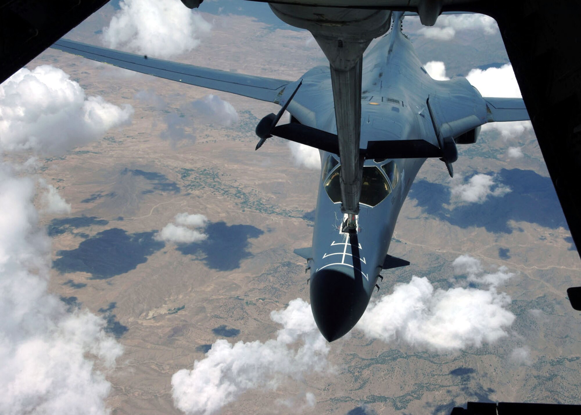 A KC-10 Extender refuels a B-1B Lancer Aug. 11 over Afghanistan in support of Operation Enduring Freedom. This was the KC-10 crew's final flight of their deployment before heading back to McGuire Air Force Base, N.J. (U.S. Air Force photo/Airman 1st Class Matthew Cook)

