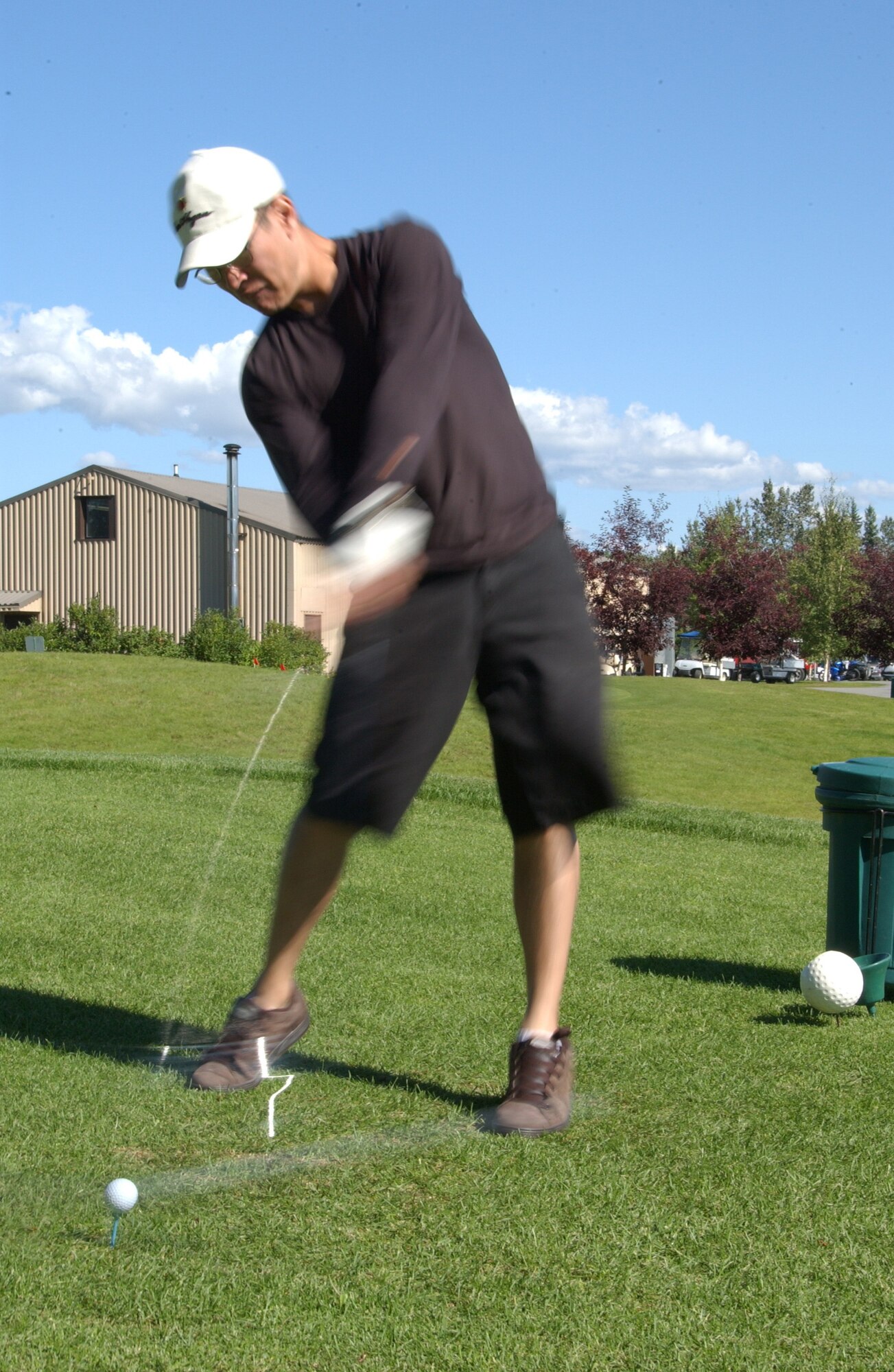 EIELSON AIR FORCE BASE, Alaska --  Senior Airman Neal Johnson, 354th Communications Squadron, smashes a golf ball on the tenth green during the Annual General?s Golf Cup Tournament Aug. 10, 2007. More than 50 men and women came out to contend in this year's tournament at Fort Wainwright. All entry fees were donated to scholarships this spring to Eielson seniors, upcoming Airman Leadership School graduations and other agencies.(U.S. Air Force photo by Airman 1st Class Christopher Griffin)