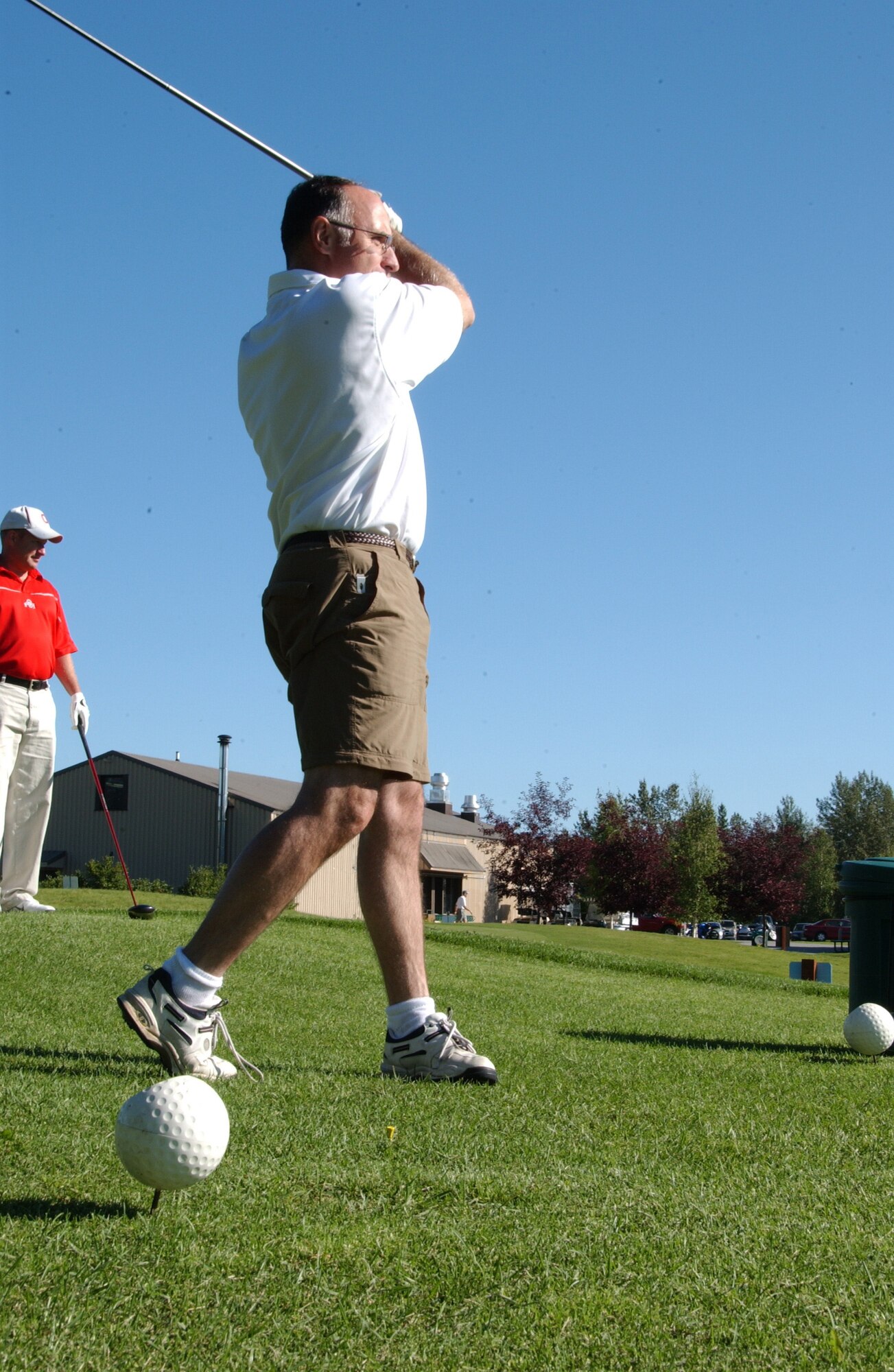 EIELSON AIR FORCE BASE, Alaska --  Brig. Gen. Dave Scott, 354th Fighter Wing commander, tees off the tenth green during the Annual General?s Cup Golf Tournament Aug. 10, 2007. More than 50 men and women came out to contend in this year's tournament at Fort Wainwright. All entry fees were donated to scholarships this spring to Eielson seniors, upcoming Airman Leadership School graduations and other agencies. (U.S. Air Force photo by Airman 1st Class Christopher Griffin)