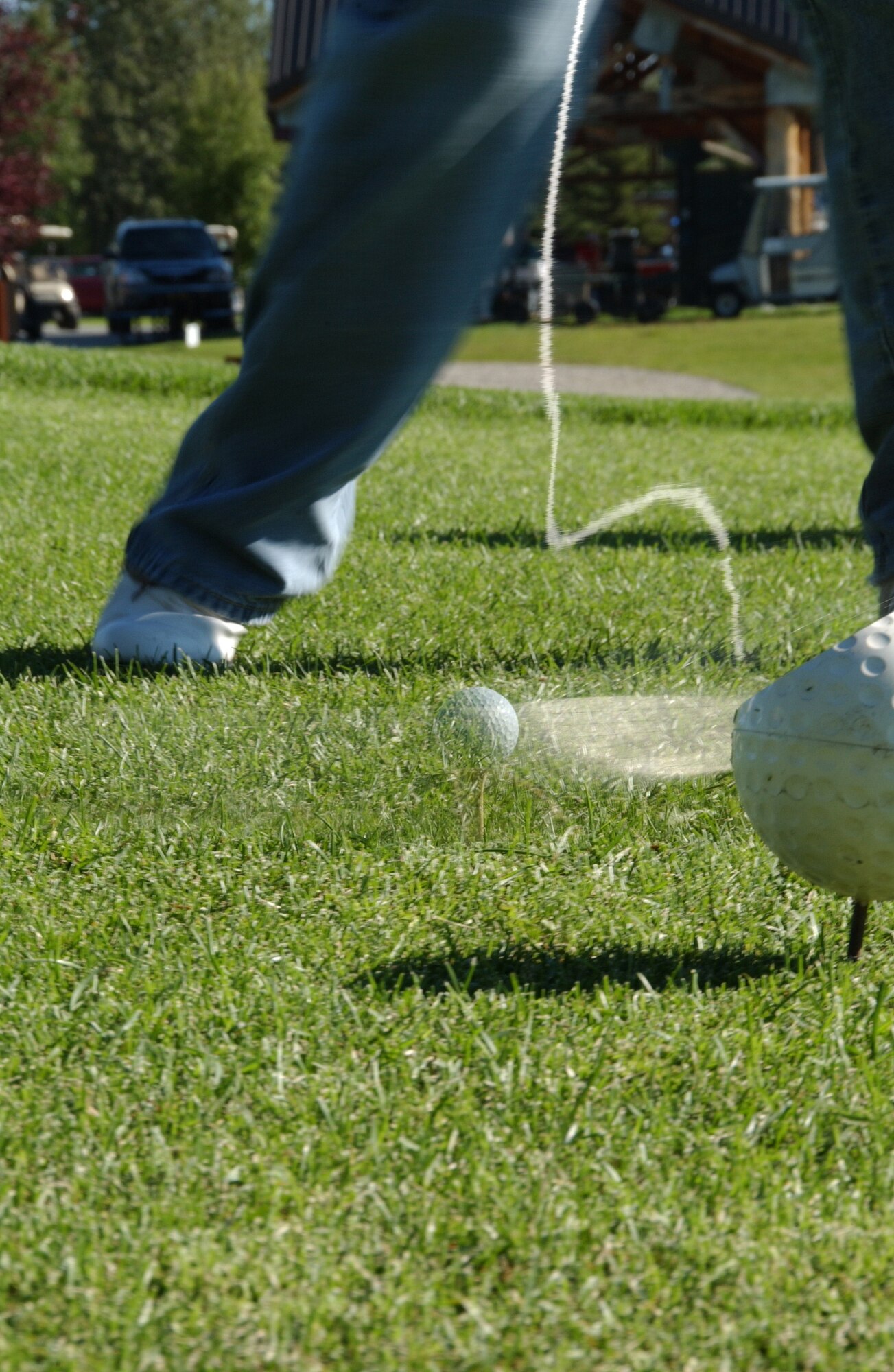 EIELSON AIR FORCE BASE, Alaska -- An Airman tees off the tenth green at the Annual General's Golf Cup Tournament Aug. 10, 2007. More than 50 men and women came out to contend in this year's tournament at Fort Wainwright. All entry fees were donated to scholarships this spring to Eielson seniors, upcoming Airman Leadership School graduations and other agencies.  (U.S. Air Force photo by Airman 1st Class Christopher Griffin)