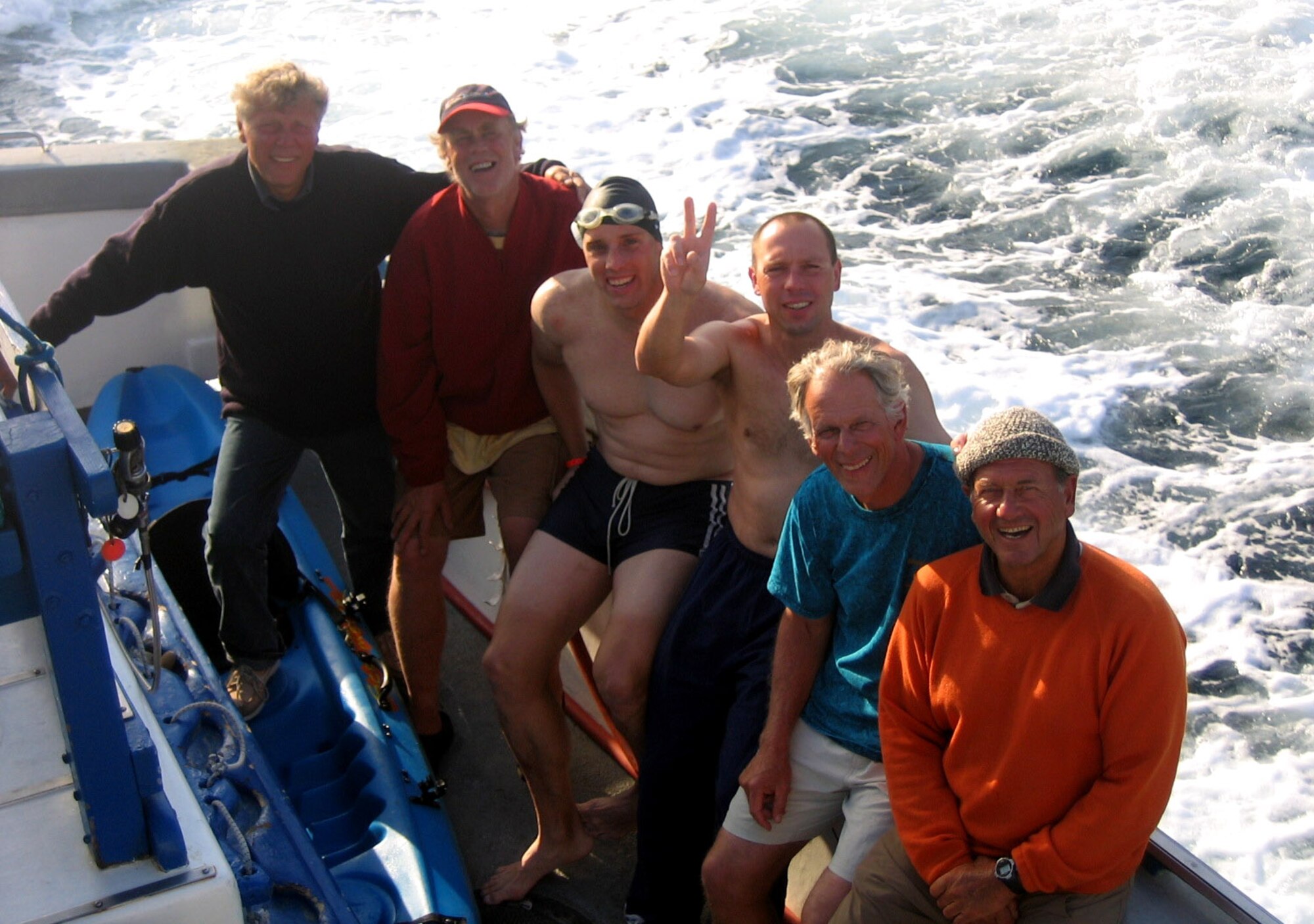 Following their long-distance relay swim Aug. 1, Lt. Col. Tim Lawrence (in swim cap) and Peter Zabel are flanked by, left to right, Peter's father Ernst, Lawrence's coach Rick Oerman and Santa BarbaraChannel Swimming Association observers Dean White and Emilio Casanueva. The two swimmers combined to swim from Santa Barbara Island to Los Angeles, a distance of 42 miles, in just over 31 hours to earn a spot in the Guinness Book of World Records.   Colonel Lawrence is an astronautical engineering professor at the U.S. Air Force Academy.  (Courtesy photo)