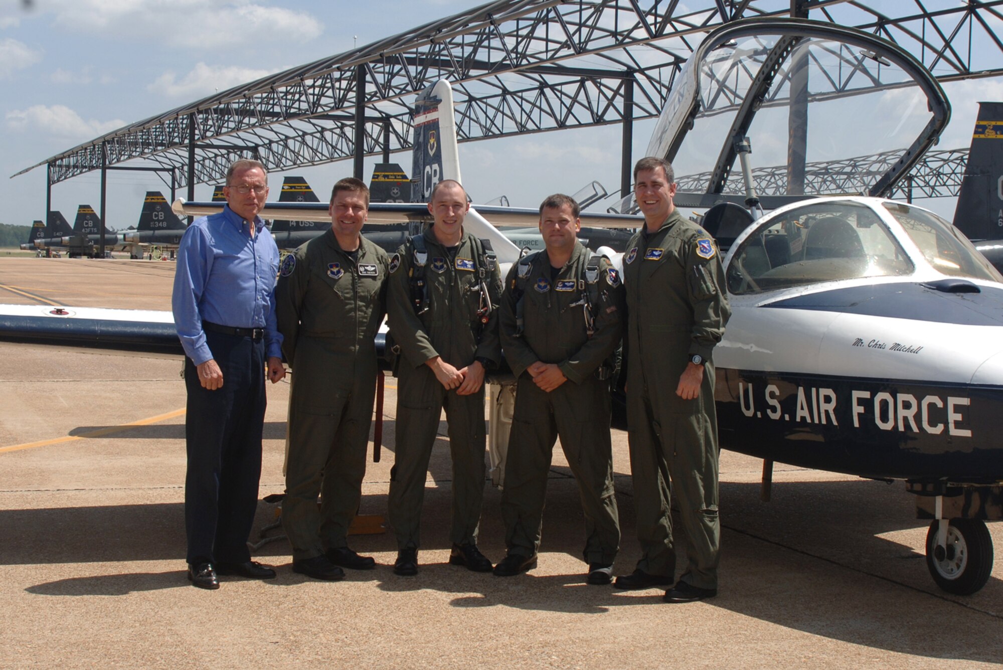 The 41st Flying Training Squadron flew their last T-37 sortie Aug. 9. Pictured here are: Jennings Cox, 41st FTS honorary commander, Col. Eric Theisen, 14th Operations Group commander, 1st Lt. Adam Flaherty and Major Brian Worthington, both 41st FTS Instructor Pilots, and Lt. Col. Charles Hamilton, 41st FTS commander. The 41st FTS will now only be training pilots in the T-6 Texan II. (U.S. Air Force photo by Airman 1st Class Danielle Powell)