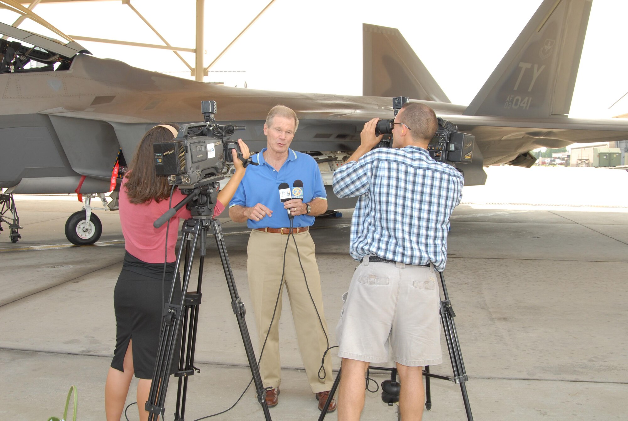 Florida Senator Bill Nelson speaks with local reporters in front of a Tyndall AFB F-22 Raptor during his base tour August 9, 2007.  Senator Nelson visited the base as part of a scheduled Florida panhandle tour.  (USAF photo/Lisa Norman)