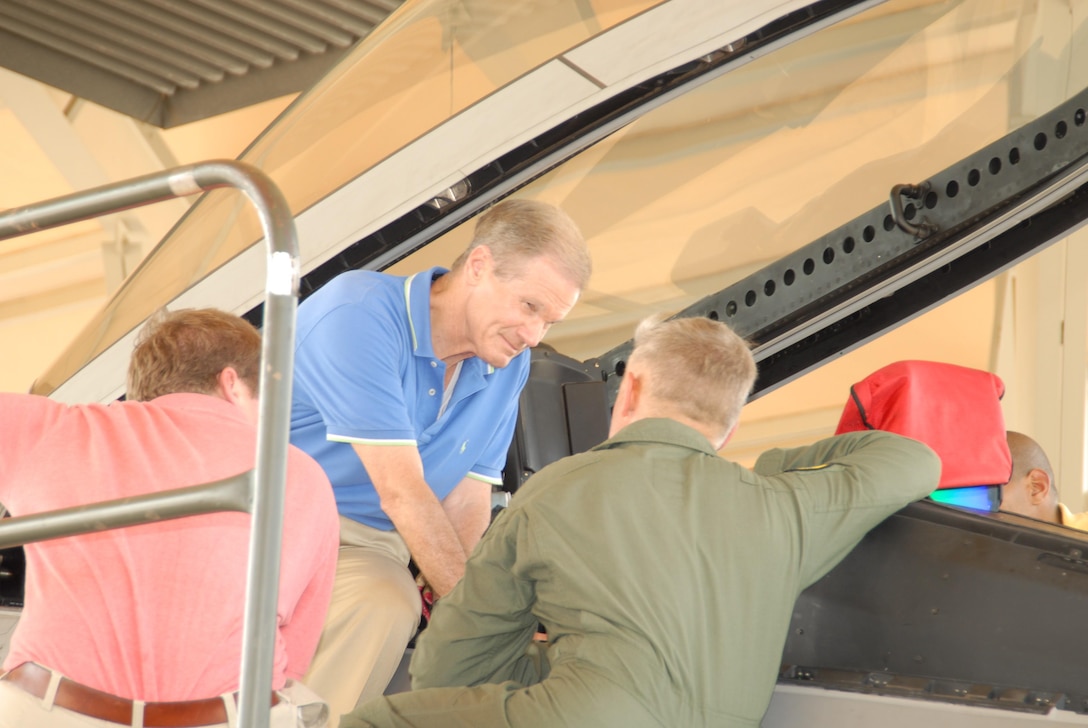 Florida Senator Bill Nelson is briefed by Colonel William H. Mott V, 325th Operations Group commander, near the canopy of a Tyndall F-22 Raptor.  Senator Nelson visited the base as part of a scheduled panhandle tour August 9, 2007.  (USAF photo/Lisa Norman)