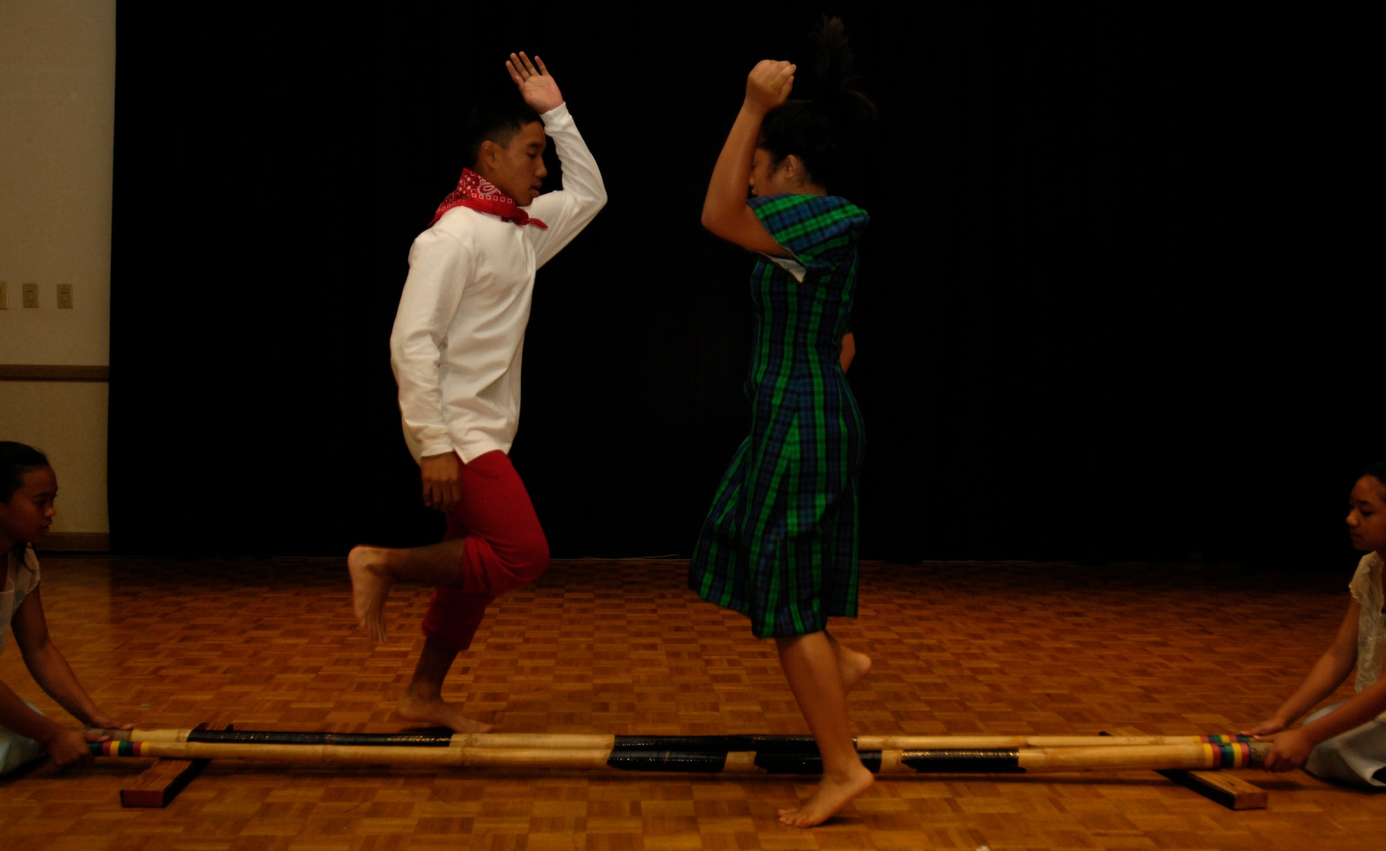 VANDENBERG AIR FORCE BASE, Calif. -- Members of the Filipino - American Dance Club from Santa Maria, Calif., perform a traditional dance during the Cultural Heritage Day here on Aug.10. Vandenberg's Cultural Heritage Day combined all annual cultural observances into one gala event of food, music, dance and displays. (U.S. Air Force photo/Airman 1st Class Christian Thomas)

