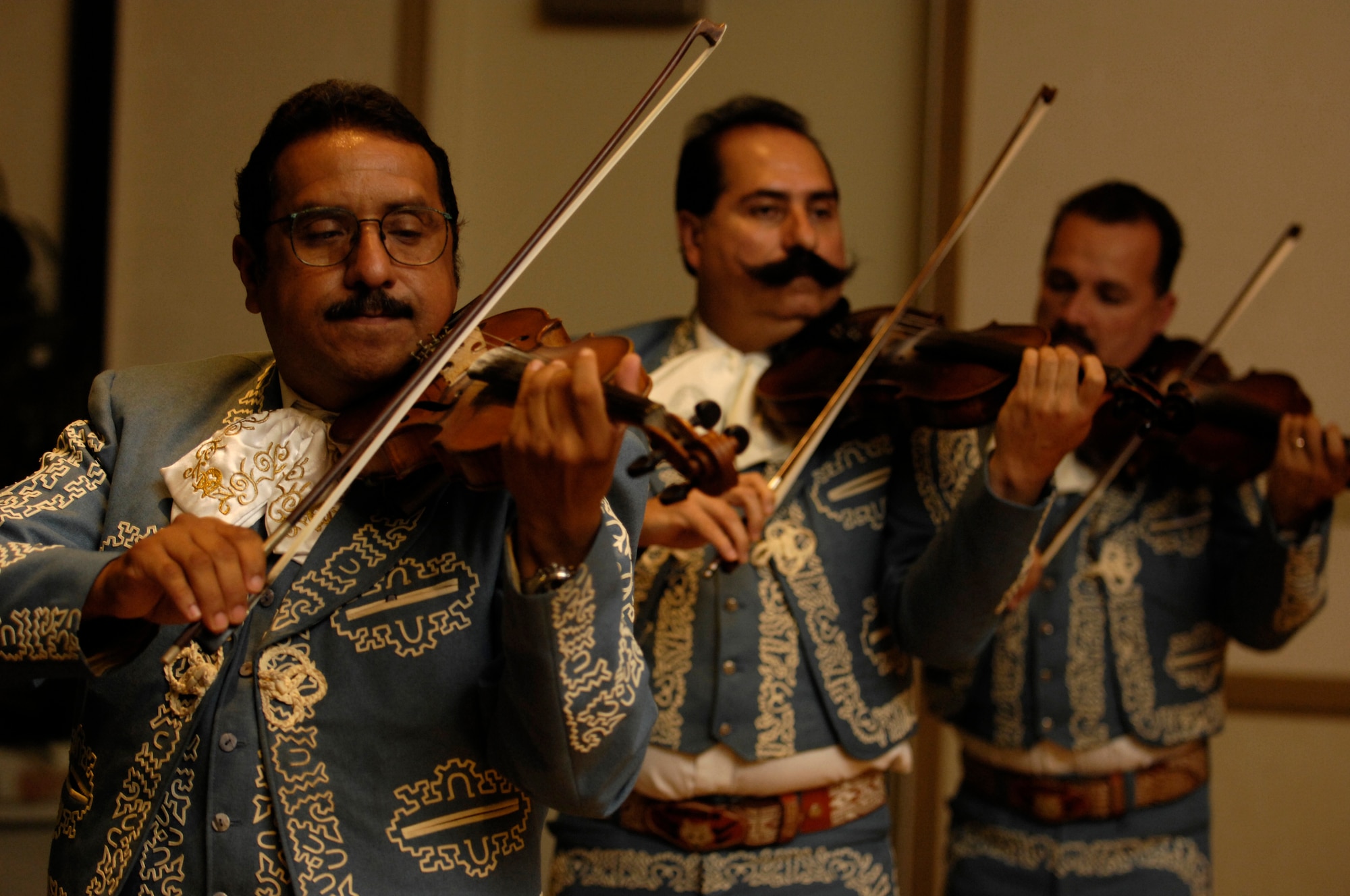 VANDENBERG AIR FORCE BASE, Calif. -- Members of Mariachi Lobos play the violin during a live performance at the Cultural Heritage Day here on Aug.10, 2008. Vandenberg's Cultural Heritage Day combined all annual cultural observances into one gala event of food, music, dance and displays. (U.S. Air Force photo/Airman 1st Class Christian Thomas)

