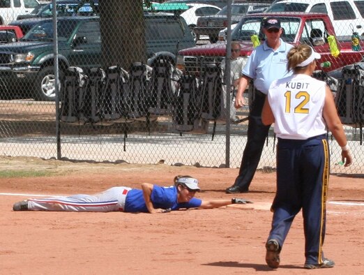 Senior Airman Latricia Munday, Kunsan Air Base, Korea, dives back to first base after a close call during the 2006 All-Armed Forces women’s softball championships. The 2007 All-Air Force Training Camp is scheduled to begin Aug. 30 with the All-Armed Forces Tournament scheduled for Sept. 18-20 here. (U.S. Air Force Photo by 1st Lt. Amber Balken)